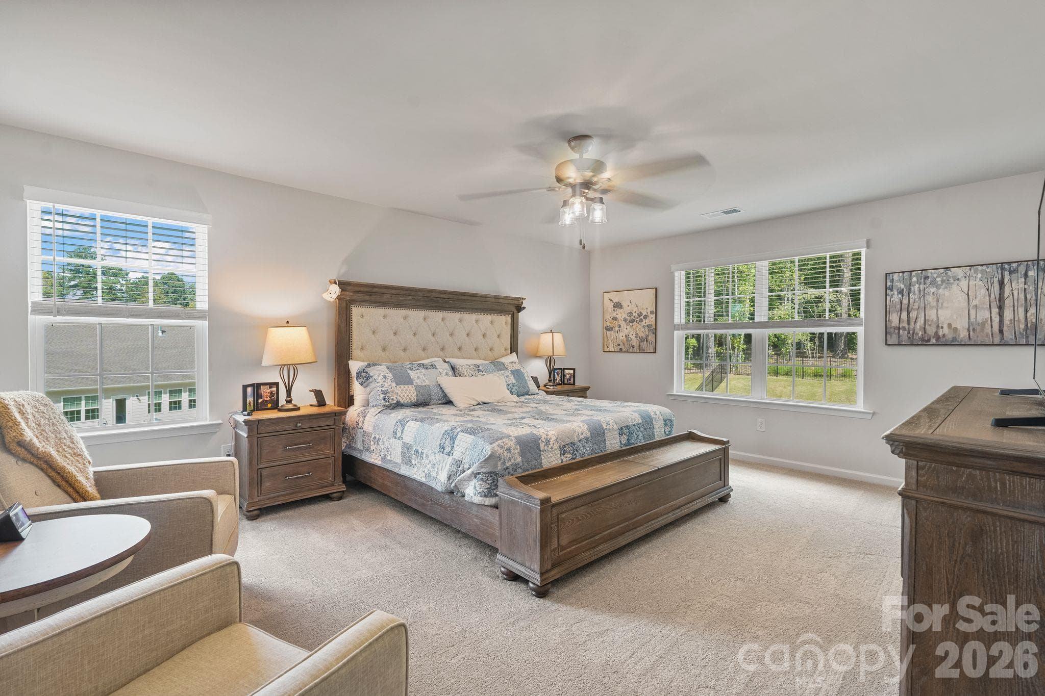 Spacious primary suite featuring an oversized bedroom and private en suite bath. - 107 Hollywood Court, Troutman