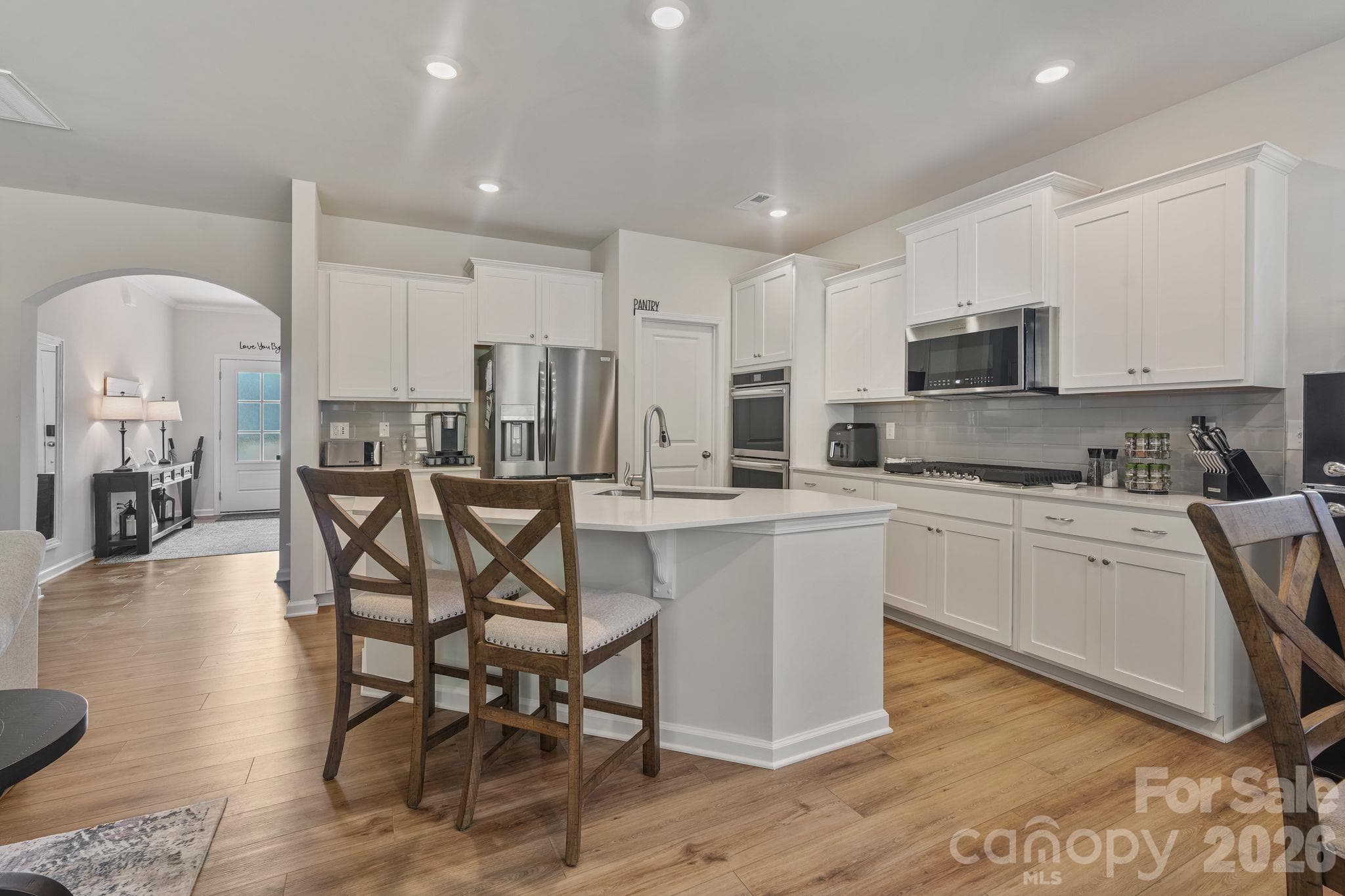 Beautiful gourmet kitchen featuring an open-concept design, perfect for everyday living and entertaining. - 107 Hollywood Court, Troutman