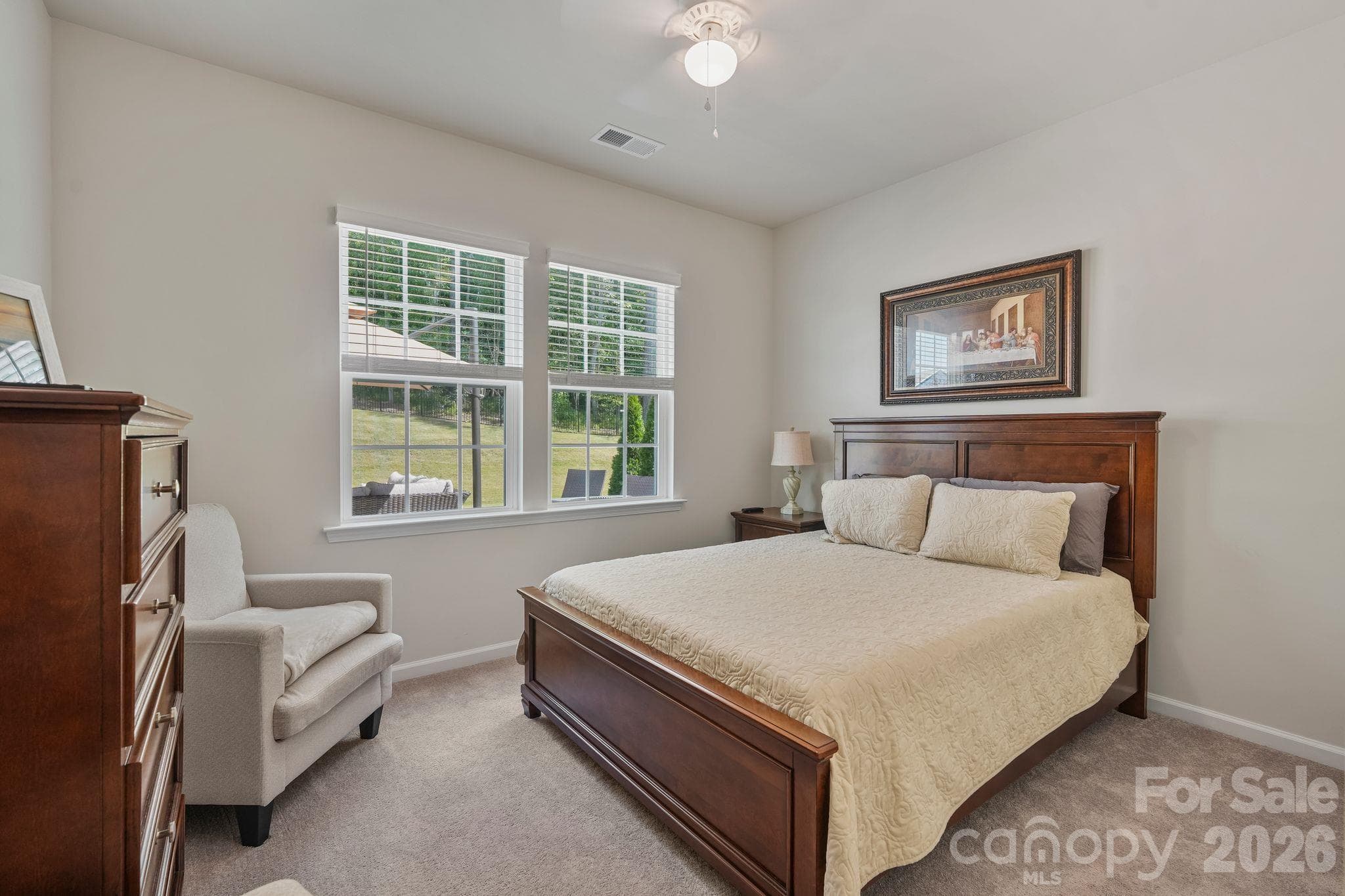 Conveniently located main-level bedroom overlooking the beautifully landscaped backyard and oversized patio. - 107 Hollywood Court, Troutman