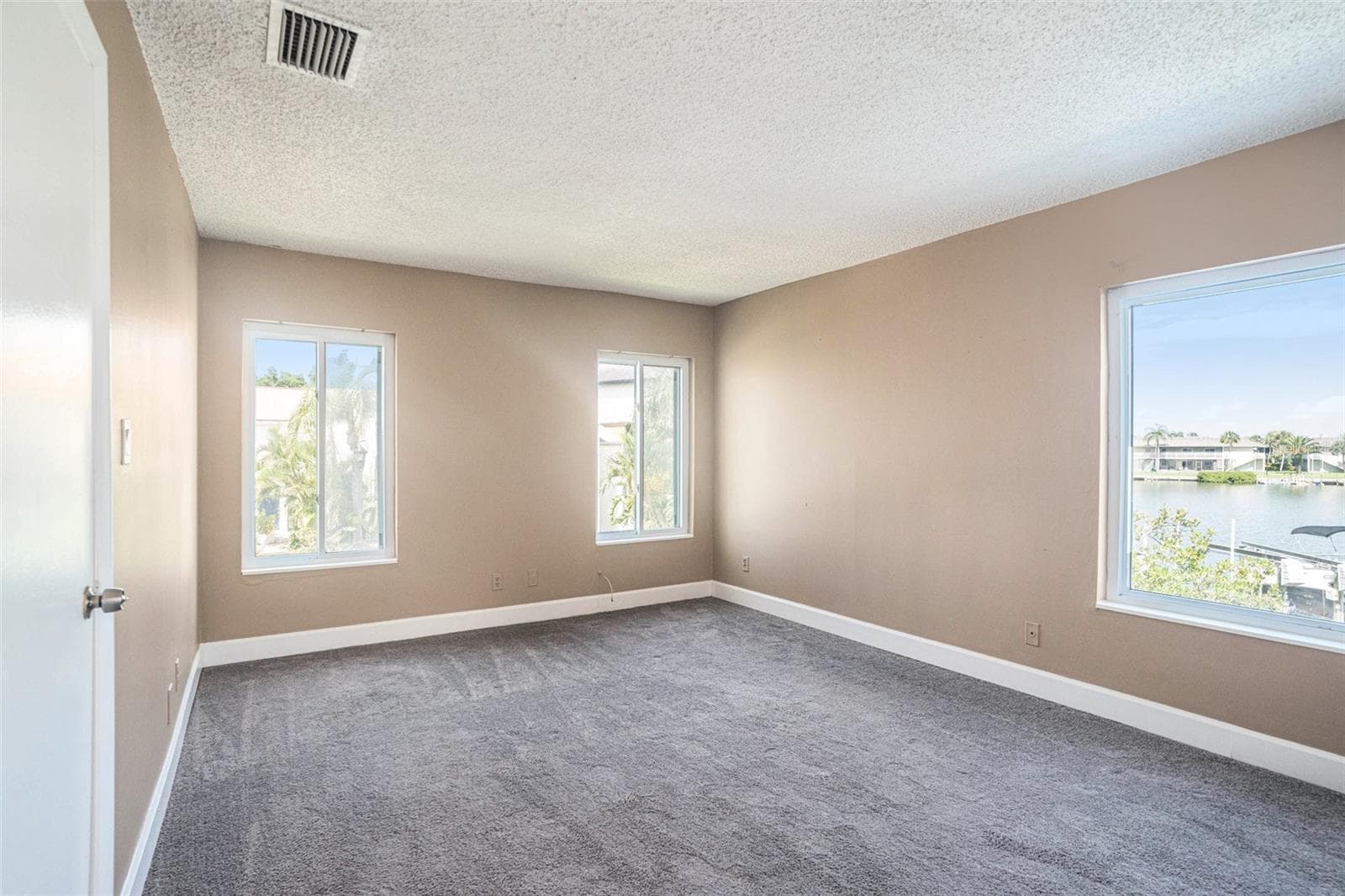 Water views. Carpet has been replaced with LVP - 8719 COVE CT #10, TAMPA