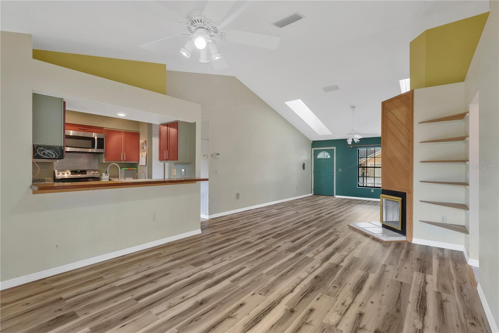 Dining Area with ceiling fan, looking at pass-through with bar into kitchen - convenient and great for entertaining - 5546 34TH CT E, BRADENTON