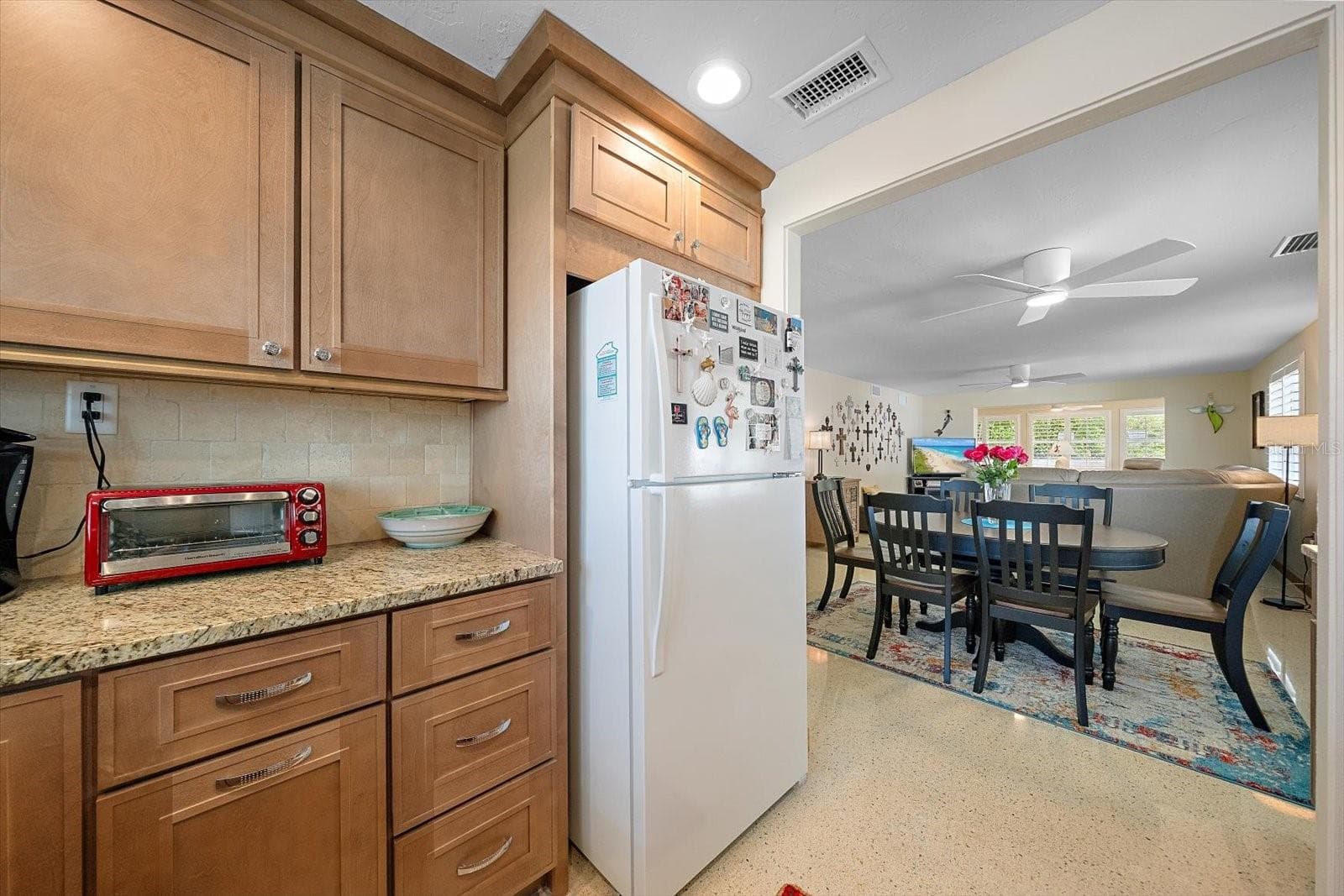 Kitchen pass-through to living and dining area - 738 SPANISH DR S #98, LONGBOAT KEY