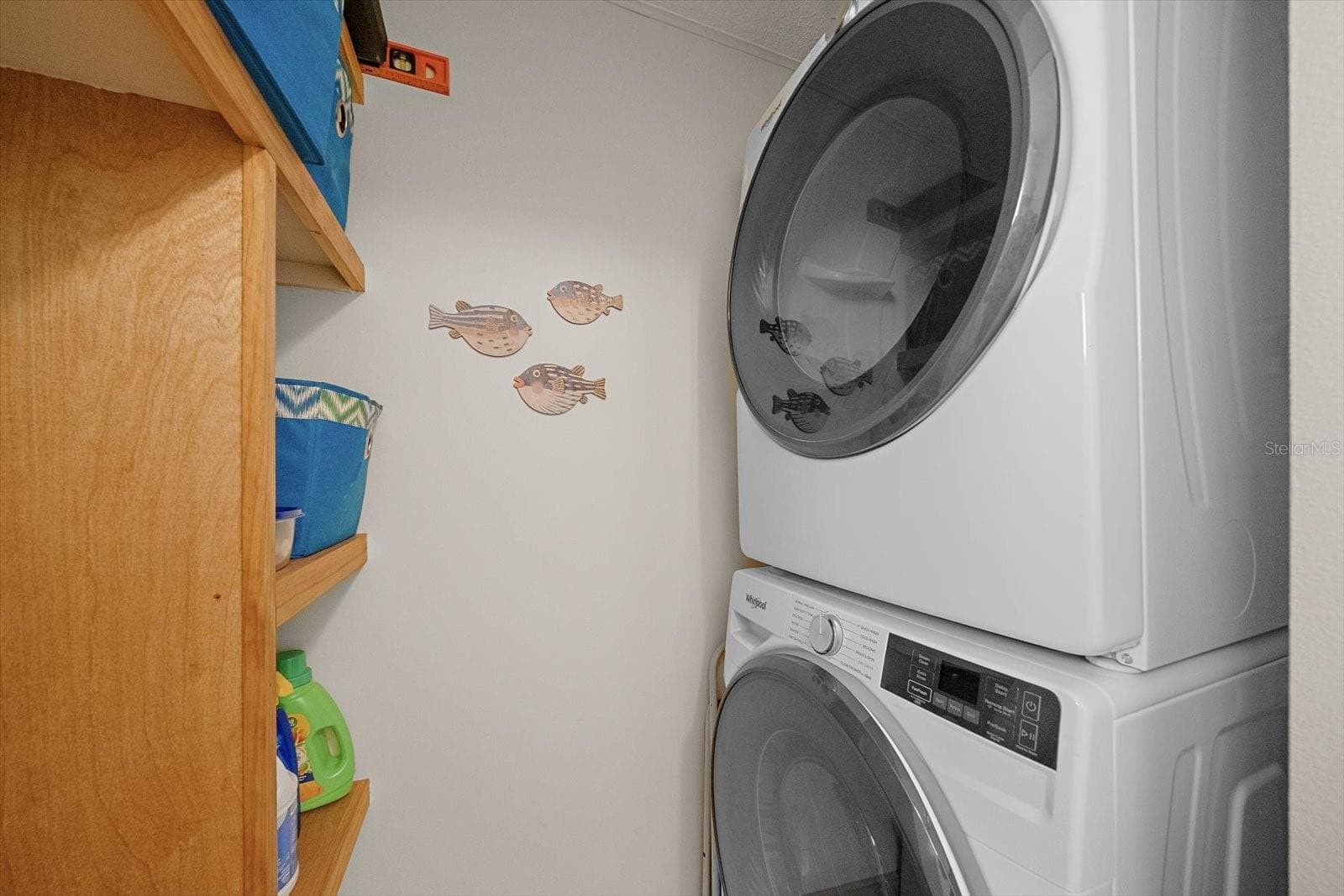 Laundry closet with stacked washer and dryer - 738 SPANISH DR S #98, LONGBOAT KEY
