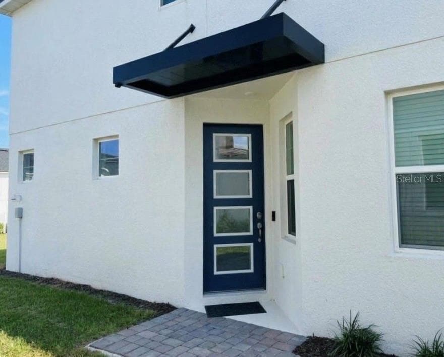 Side entrance - 1123 BOARDWALK PL, KISSIMMEE