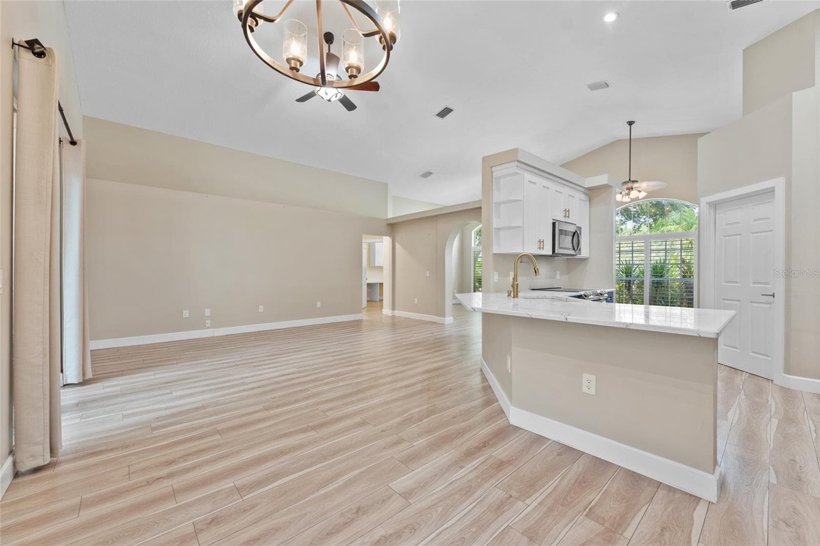 dining and living area - 4287 TREMBLAY WAY, PALM HARBOR
