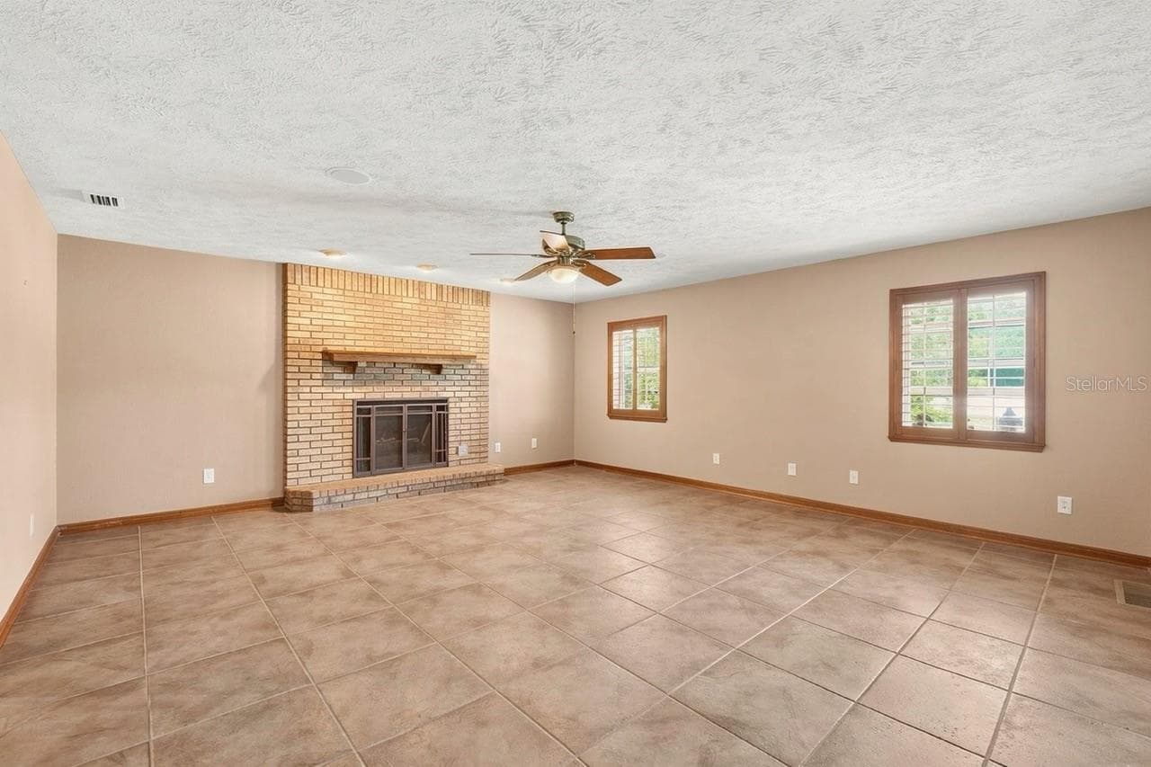 Virtually stage Living room with Gas Fireplace - 8699 SE 12TH CT, OCALA