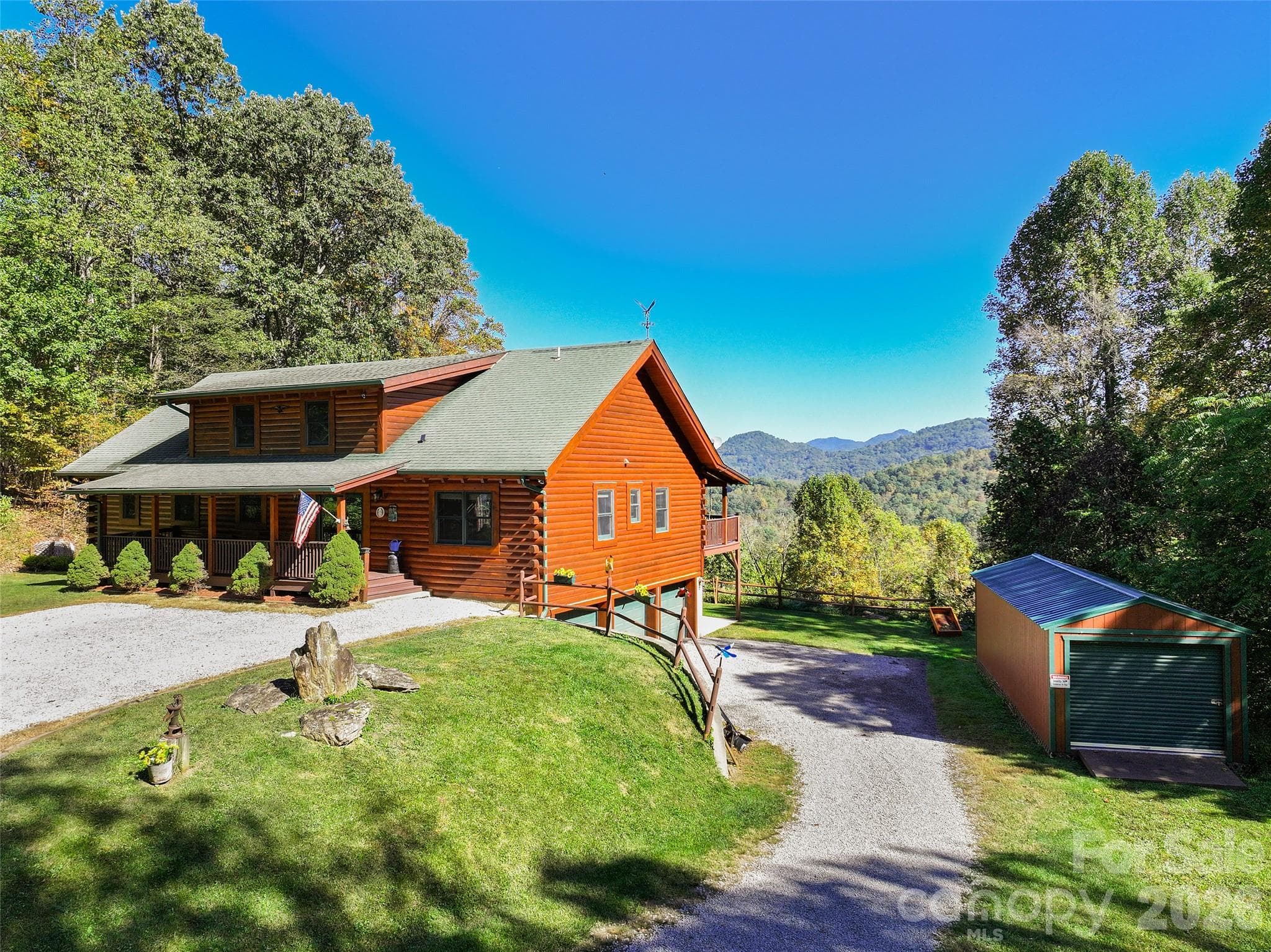 Welcoming entrance, spacious driveway, and picturesque mountain backdrop. - 124 Borges Lane, Waynesville