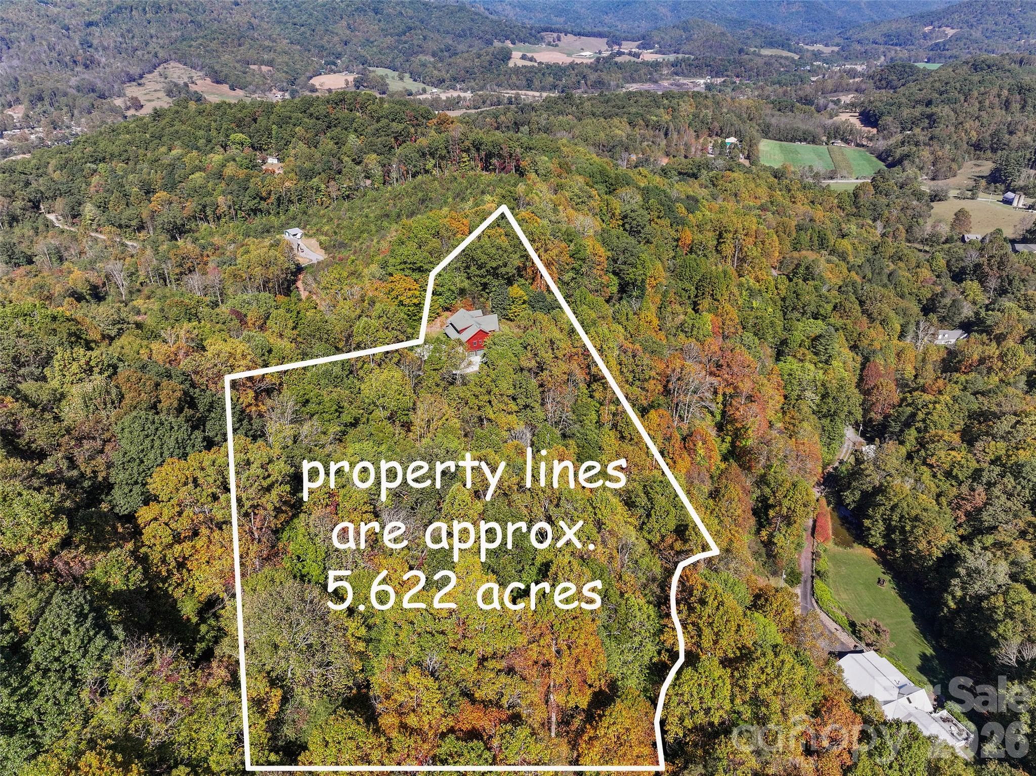Aerial view highlighting the approximate boundaries of the 5.622-acre property. - 124 Borges Lane, Waynesville