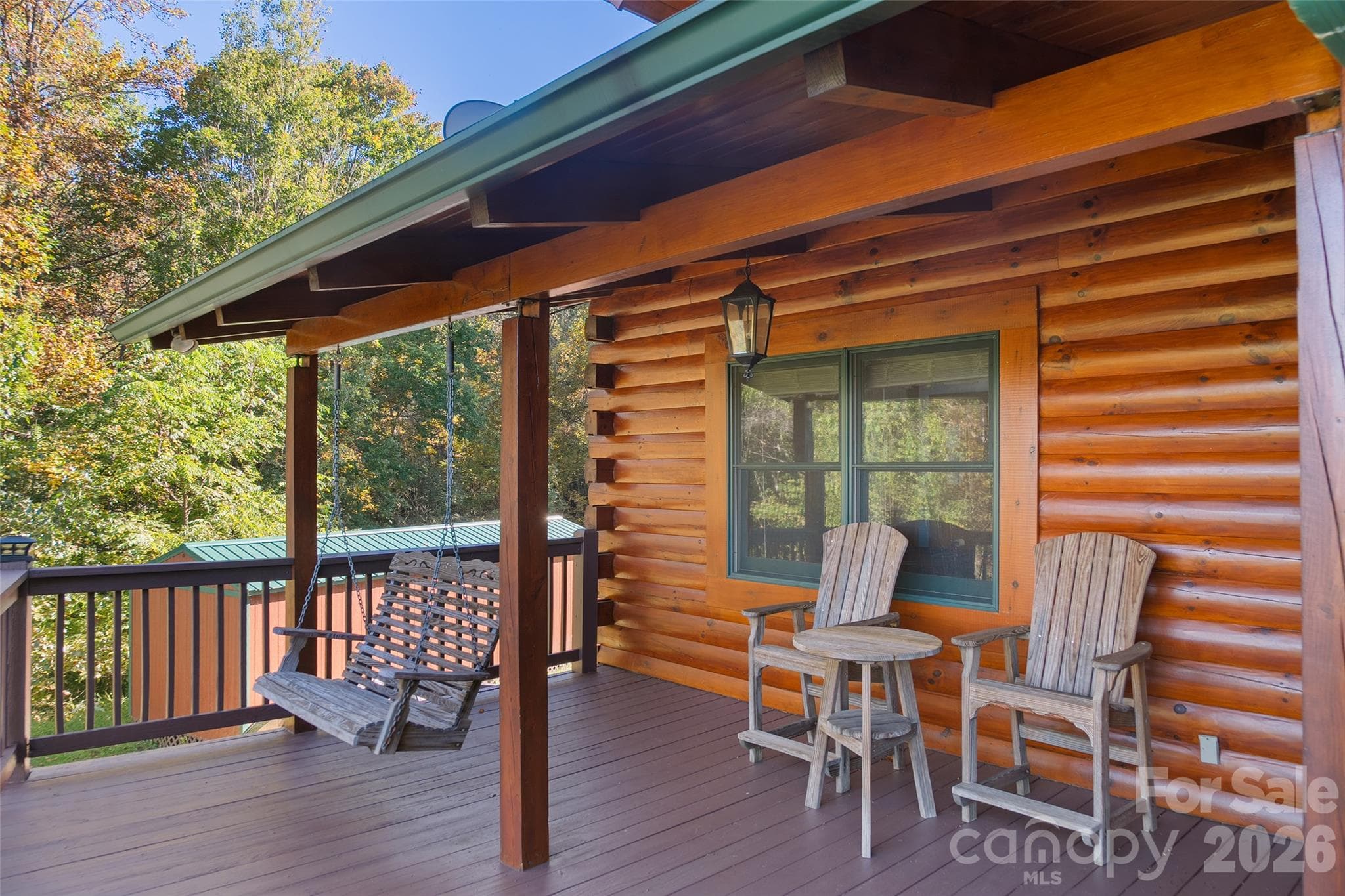 Relax on the covered porch and take in the fresh mountain air. - 124 Borges Lane, Waynesville