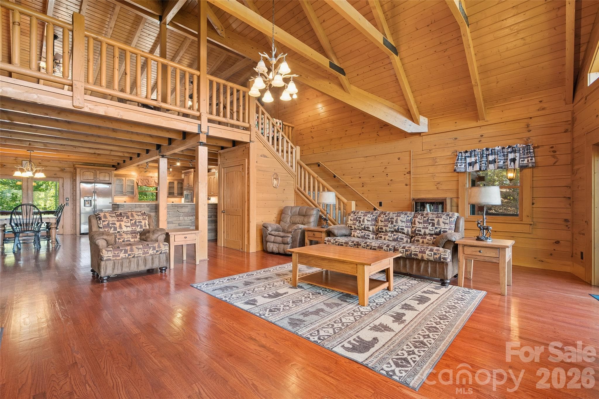 Expansive living area offers a welcoming space for entertaining or relaxing. - 124 Borges Lane, Waynesville
