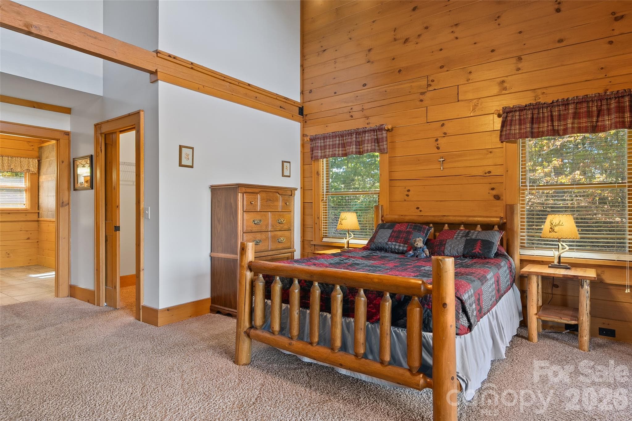 Main-level primary suite offers comfort, privacy, and generous space. - 124 Borges Lane, Waynesville