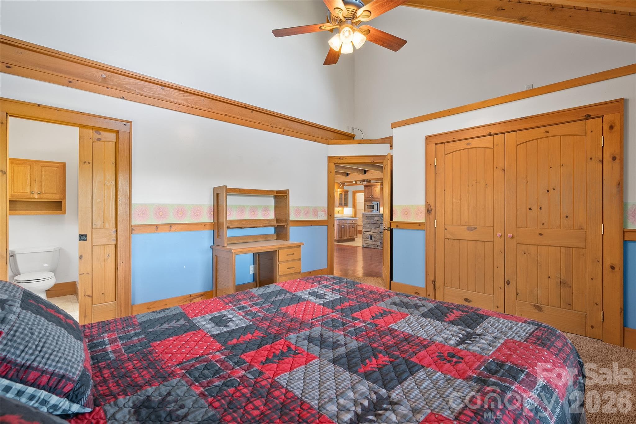 Generously sized bedroom with attractive wood accents and natural light. - 124 Borges Lane, Waynesville