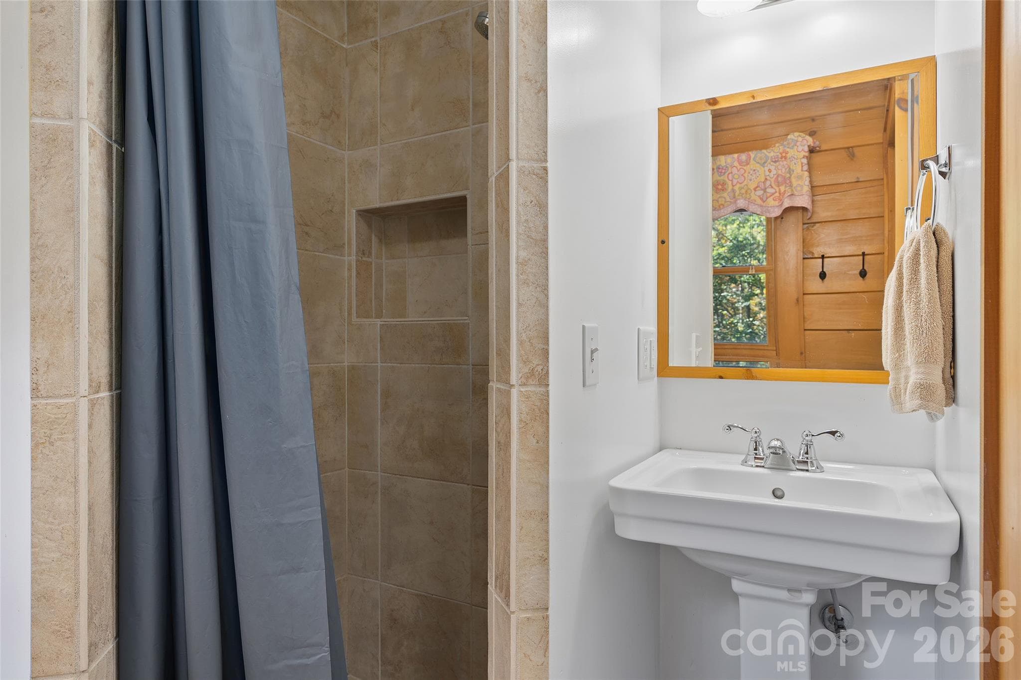 Full bathroom featuring a tiled shower and attractive finishes. - 124 Borges Lane, Waynesville