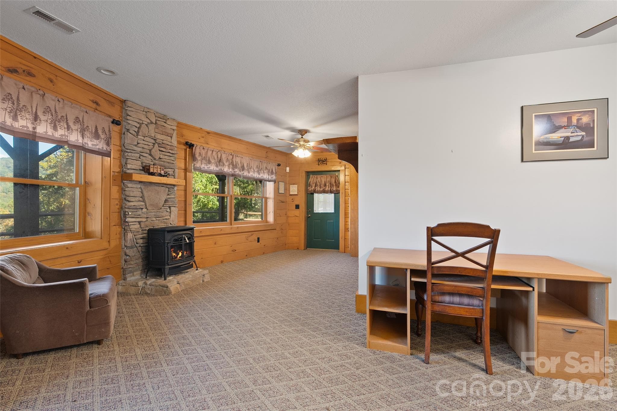 Lower-level family room offers additional living and entertaining space. - 124 Borges Lane, Waynesville