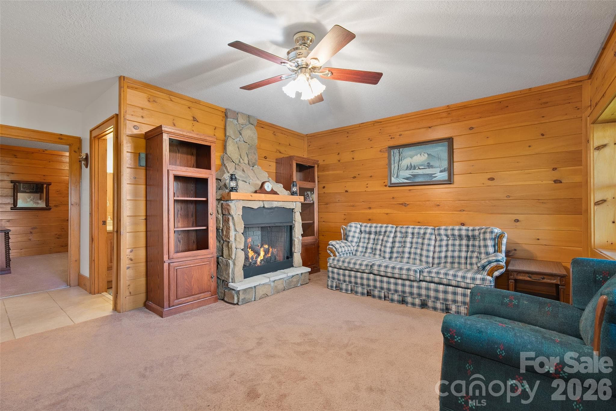 Comfortable family room with fireplace and room to relax. - 124 Borges Lane, Waynesville