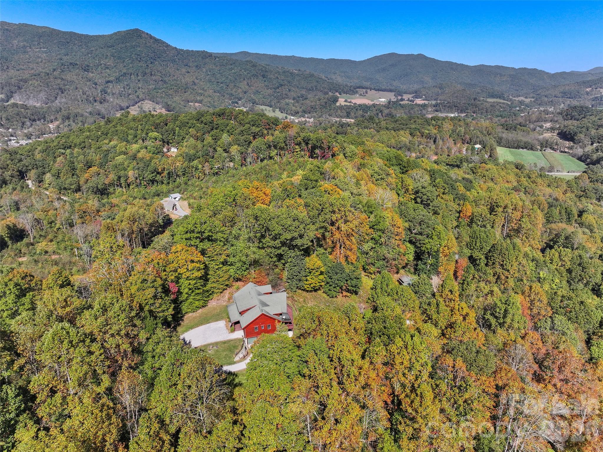 Sweeping aerial view of the surrounding mountains and wooded countryside. - 124 Borges Lane, Waynesville