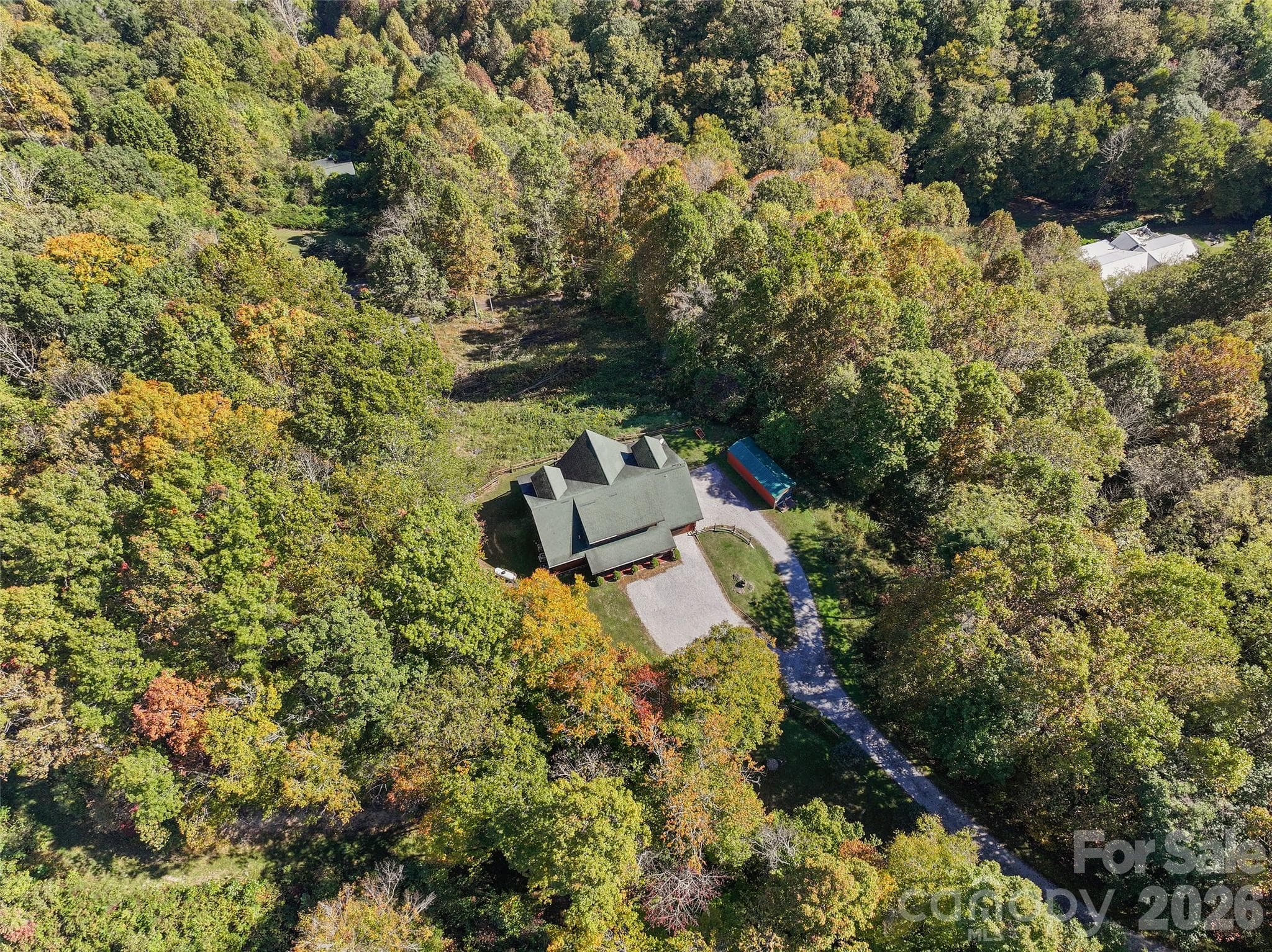 Aerial perspective showcases the home's privacy and natural surroundings. - 124 Borges Lane, Waynesville