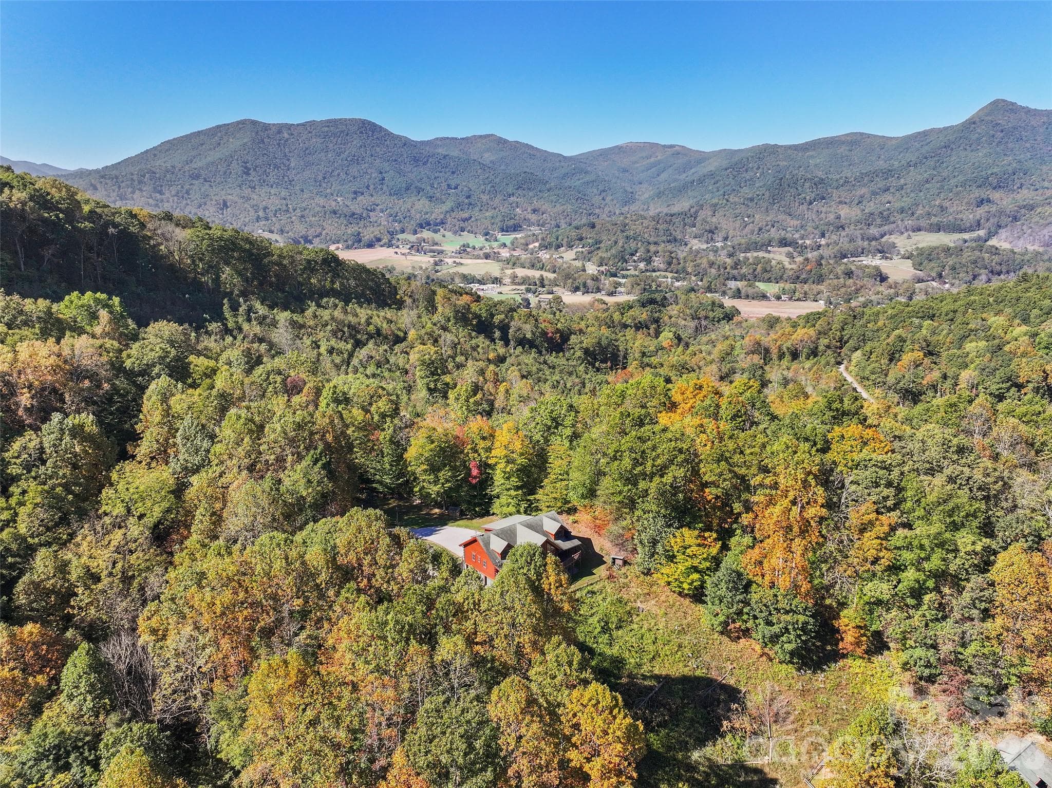 Elevated aerial view highlights the scenic mountain surroundings. - 124 Borges Lane, Waynesville