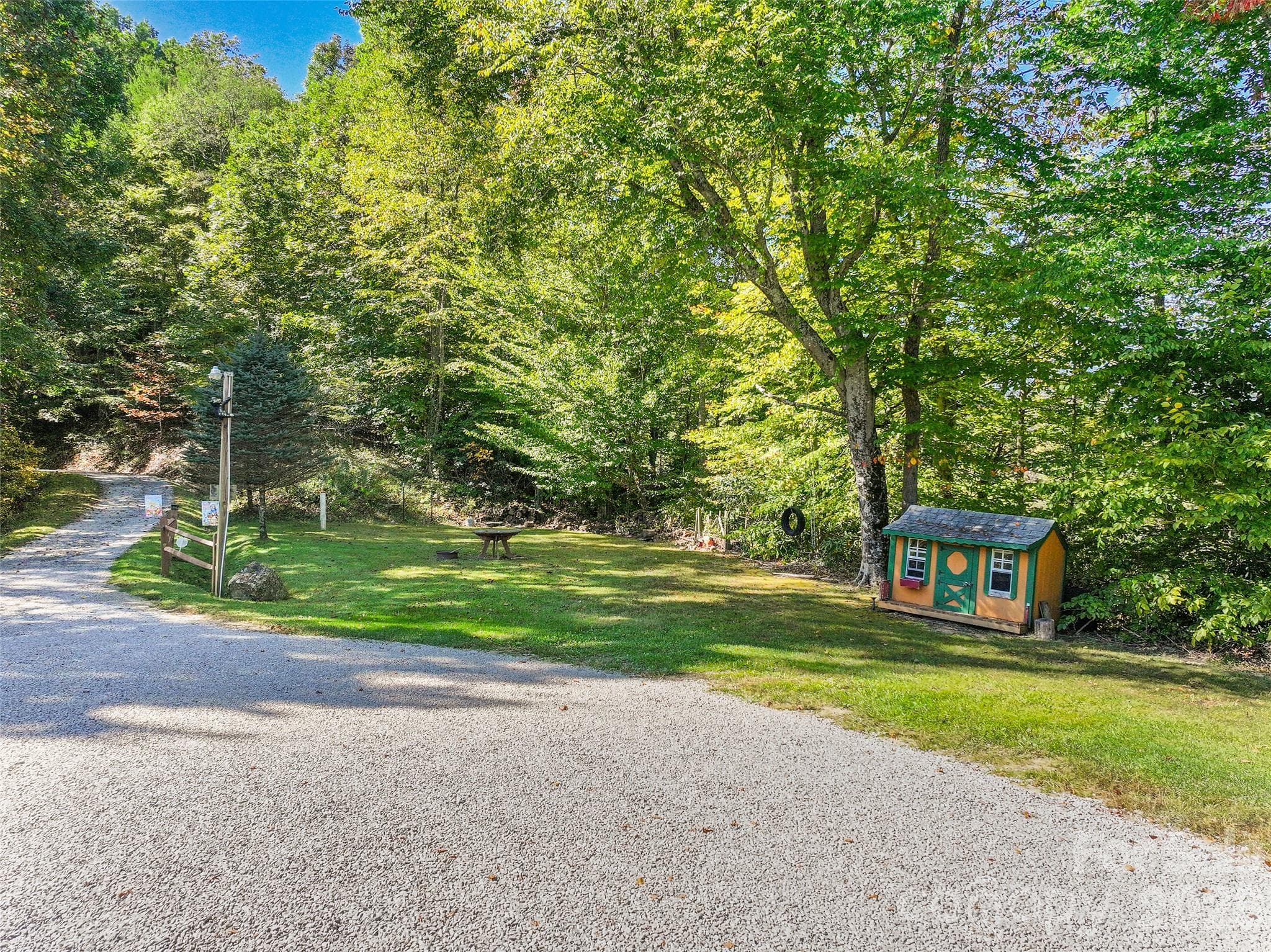 Spacious driveway and natural surroundings welcome you home. - 124 Borges Lane, Waynesville