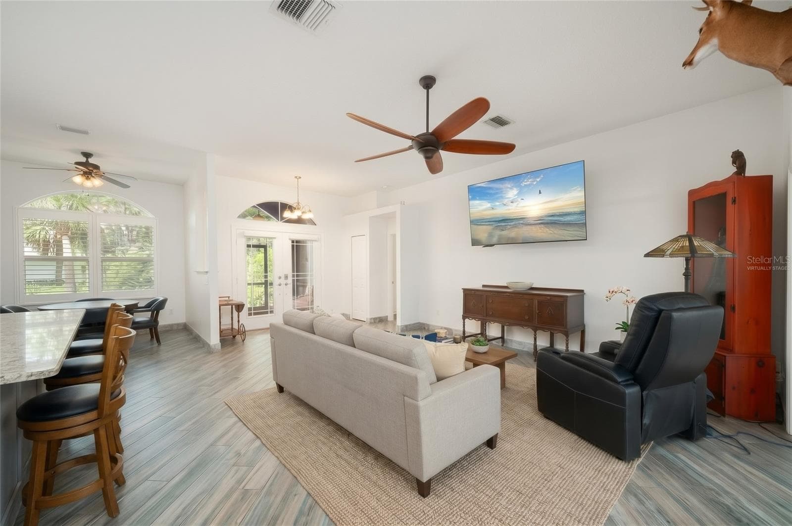 Greatroom Virtually Staged - 2508 TROPICAIRE BLVD, NORTH PORT
