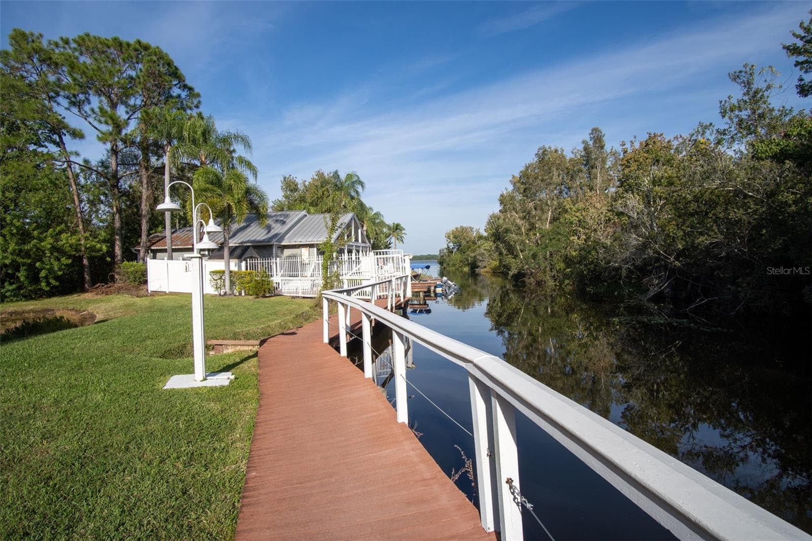 Walkway to Clubhouse, Pool and Firepit, Boat Dock, Fishing Pier, Cleaning Station & Kayak Storage! - 2511 DOLLY BAY DR #104, PALM HARBOR