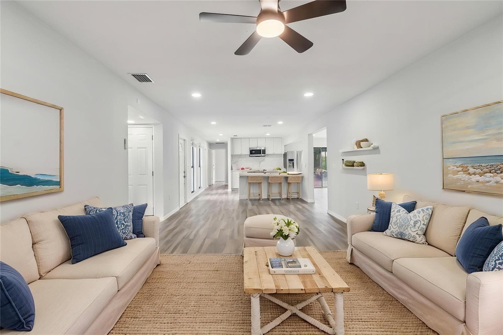 beautifully updated, spacious living room featured vaulted ceiling, modern flooring, open concept - 1023 DEER RUN, VENICE