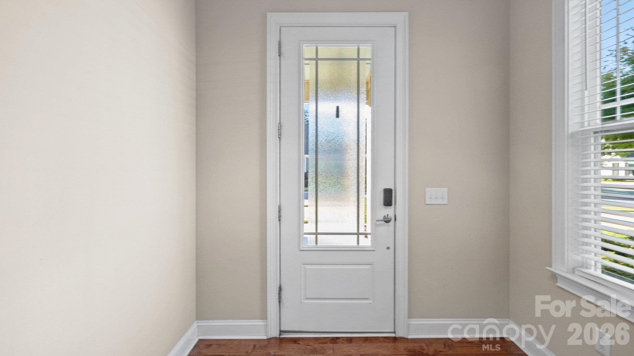 Welcoming foyer with decorative glass front door - 2050 Laney Pond Road, Matthews