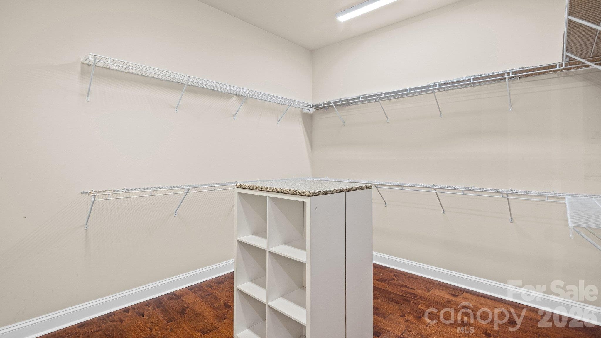 Large walk-in closet with custom shelving - 2050 Laney Pond Road, Matthews