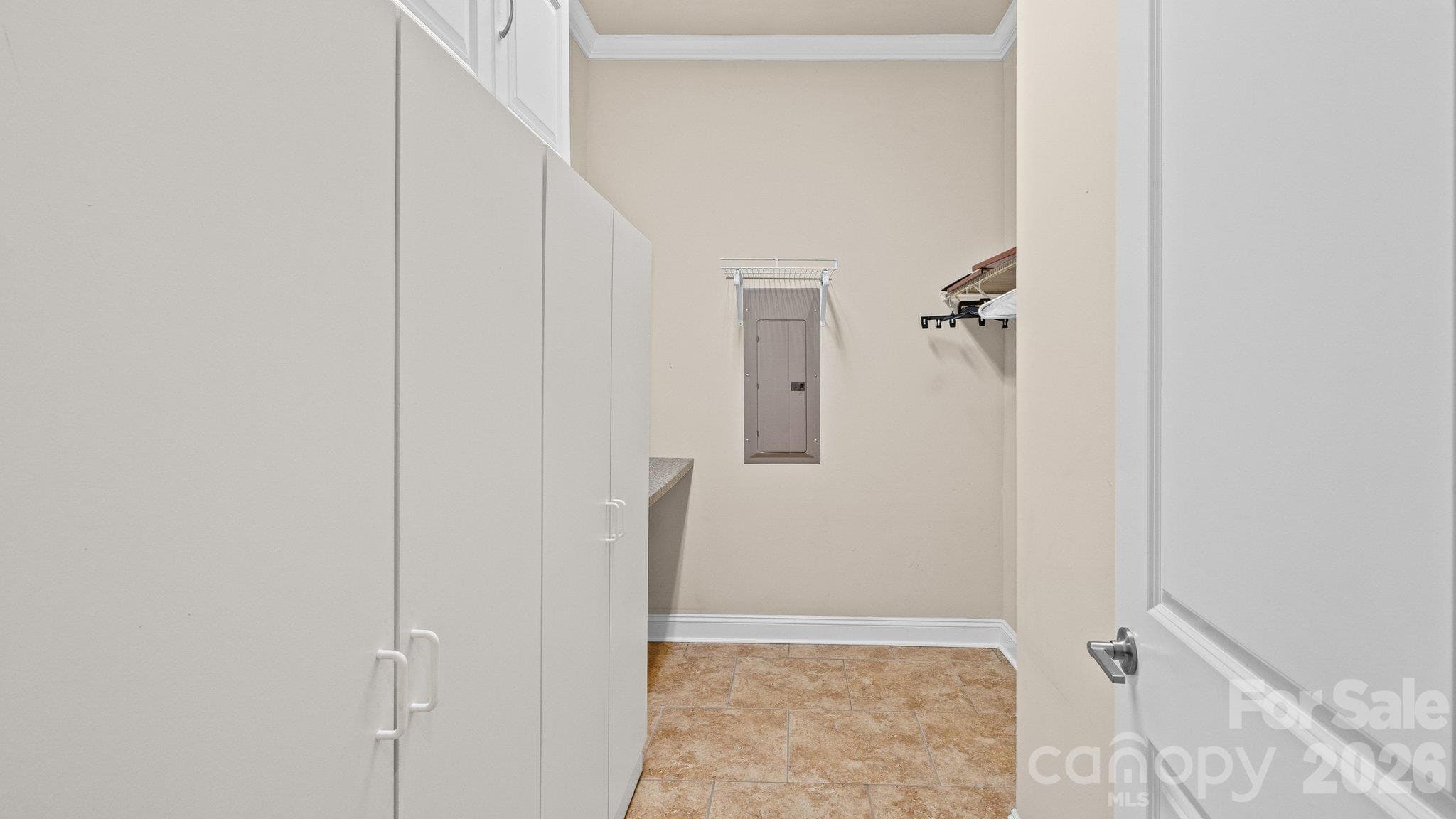 Laundry room with shelving - 2050 Laney Pond Road, Matthews