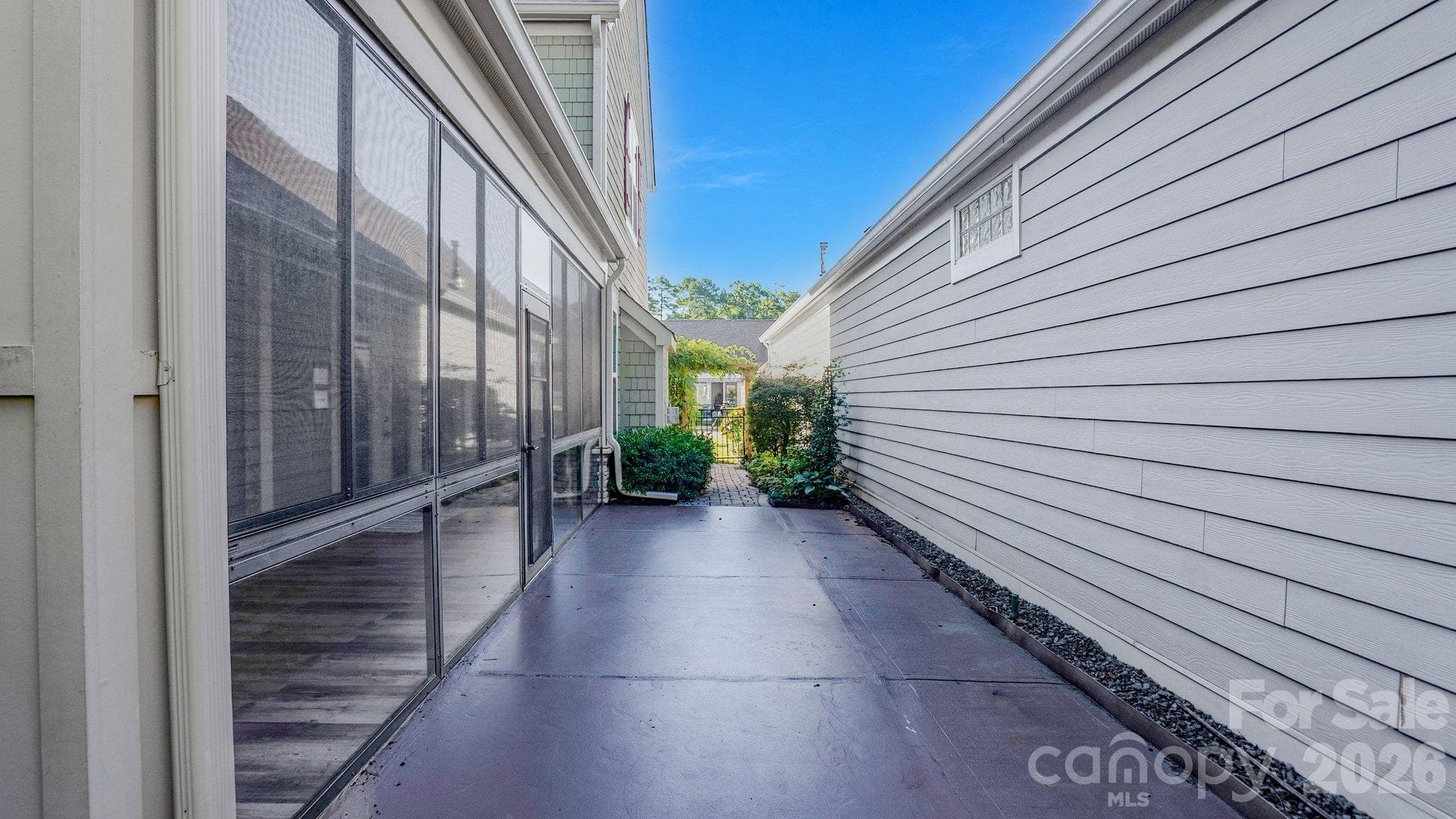 Rear patio alongside the sunroom - 2050 Laney Pond Road, Matthews