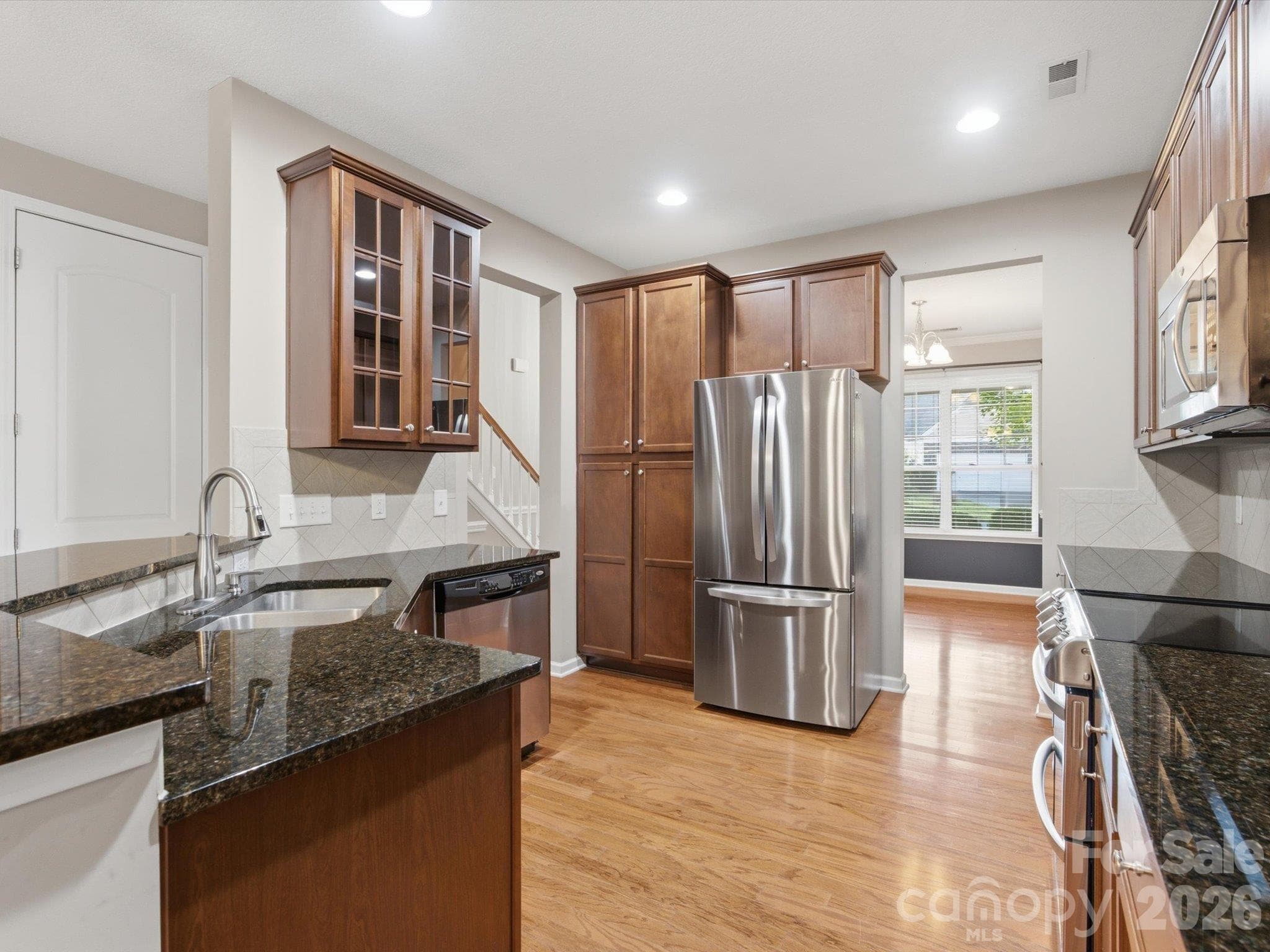 Kitchen looking into the dining room/sitting room. - 15110 Reminisce Lane, Charlotte