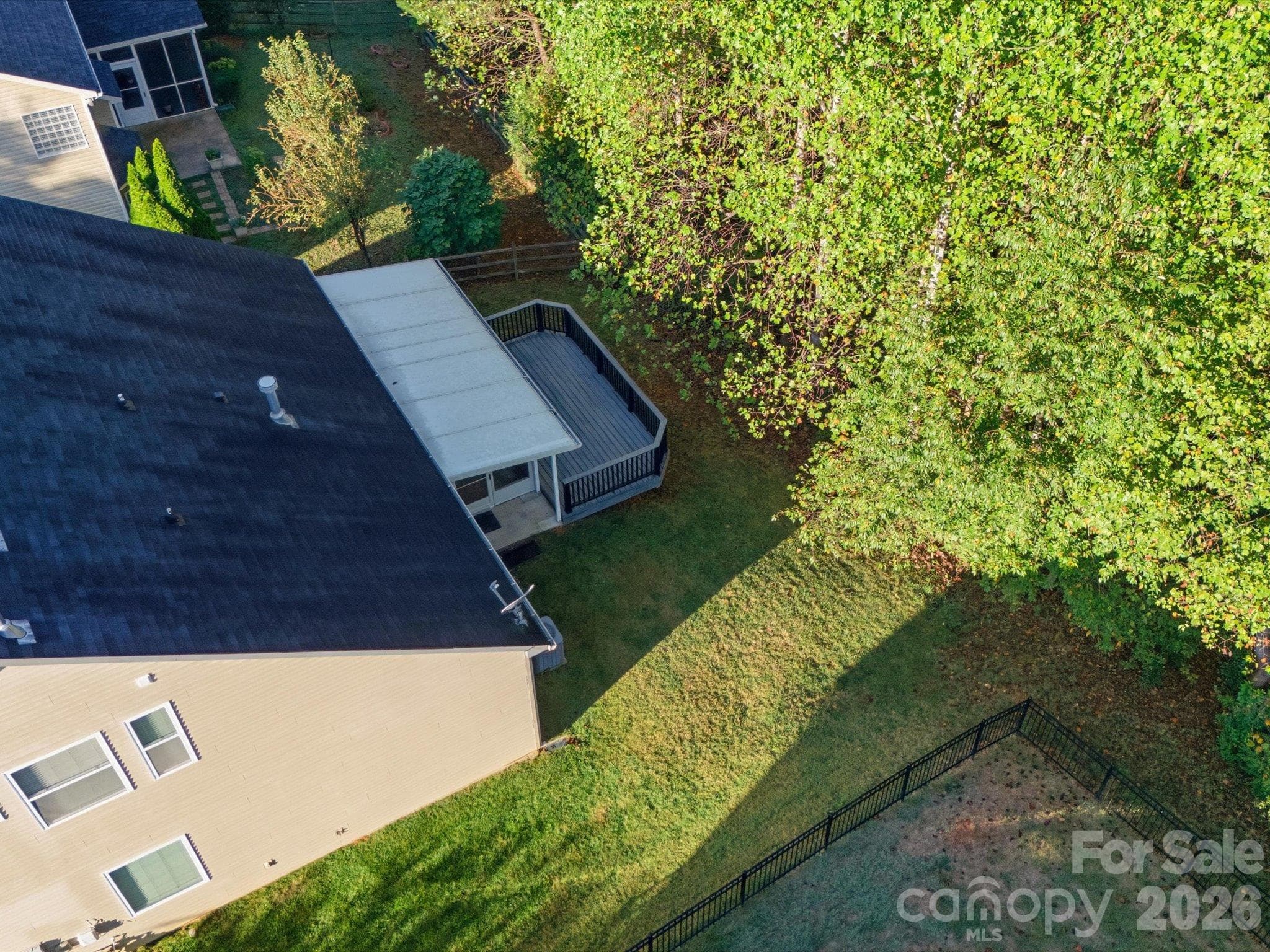Ariel back of home showing porch and deck. - 15110 Reminisce Lane, Charlotte