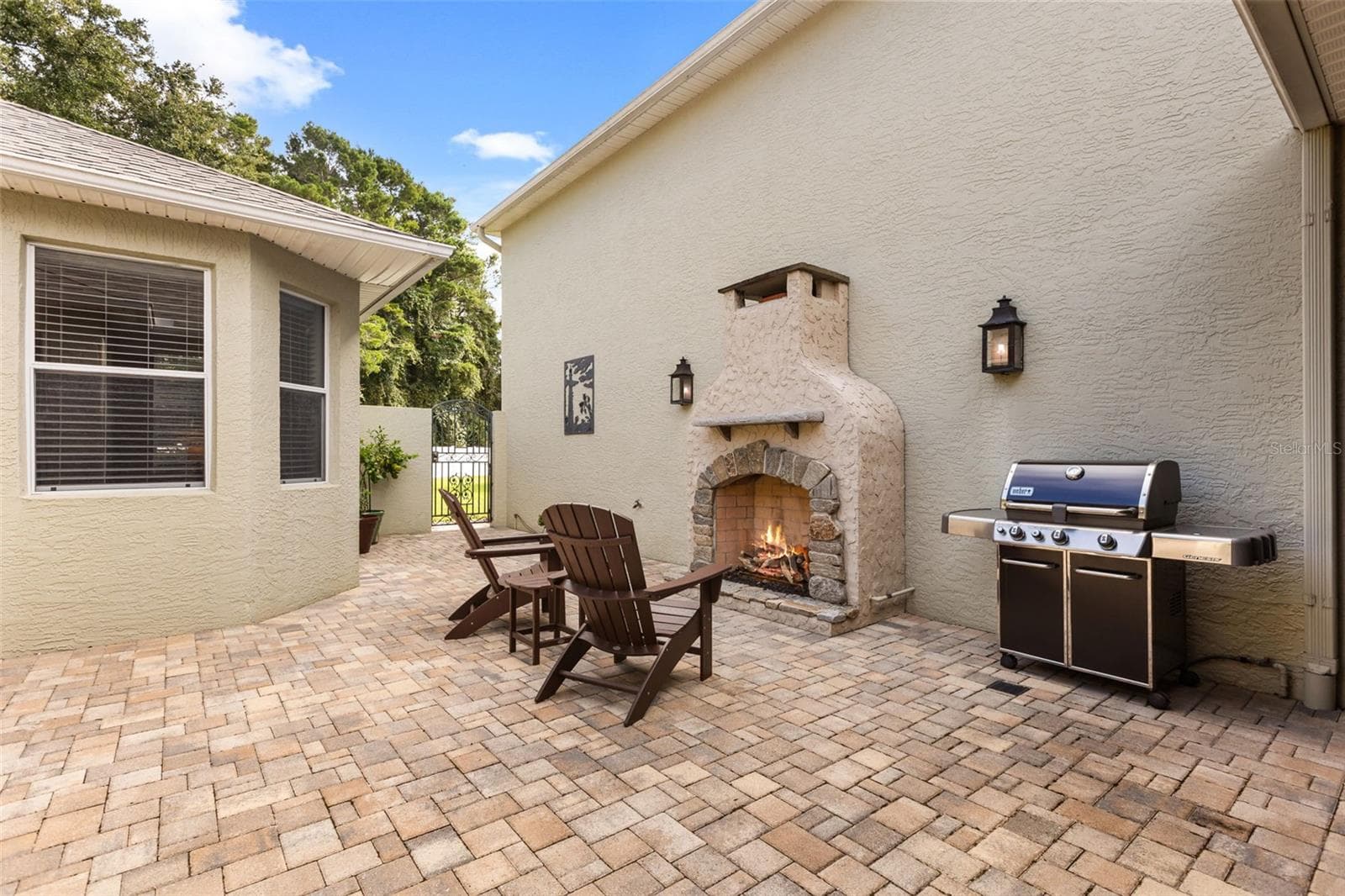 Private Courtyard with Outdoor Gas Fireplace, Paver Patio & 2 Custom Copper Gas Lanterns - 4711 HERITAGE TRL, LEESBURG