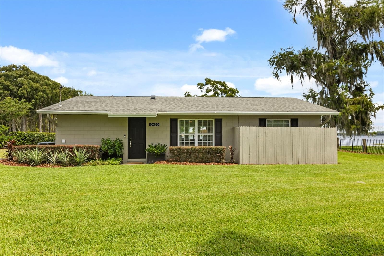 An existing two-bedroom, 1.5-bath cottage currently occupies the property. - 10430 LAKE COTTAGE LN, ORLANDO