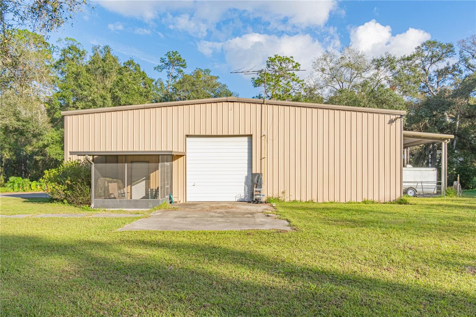 Side View with 2nd Screen Porch off Office area. - 2557 CR 674A, BUSHNELL