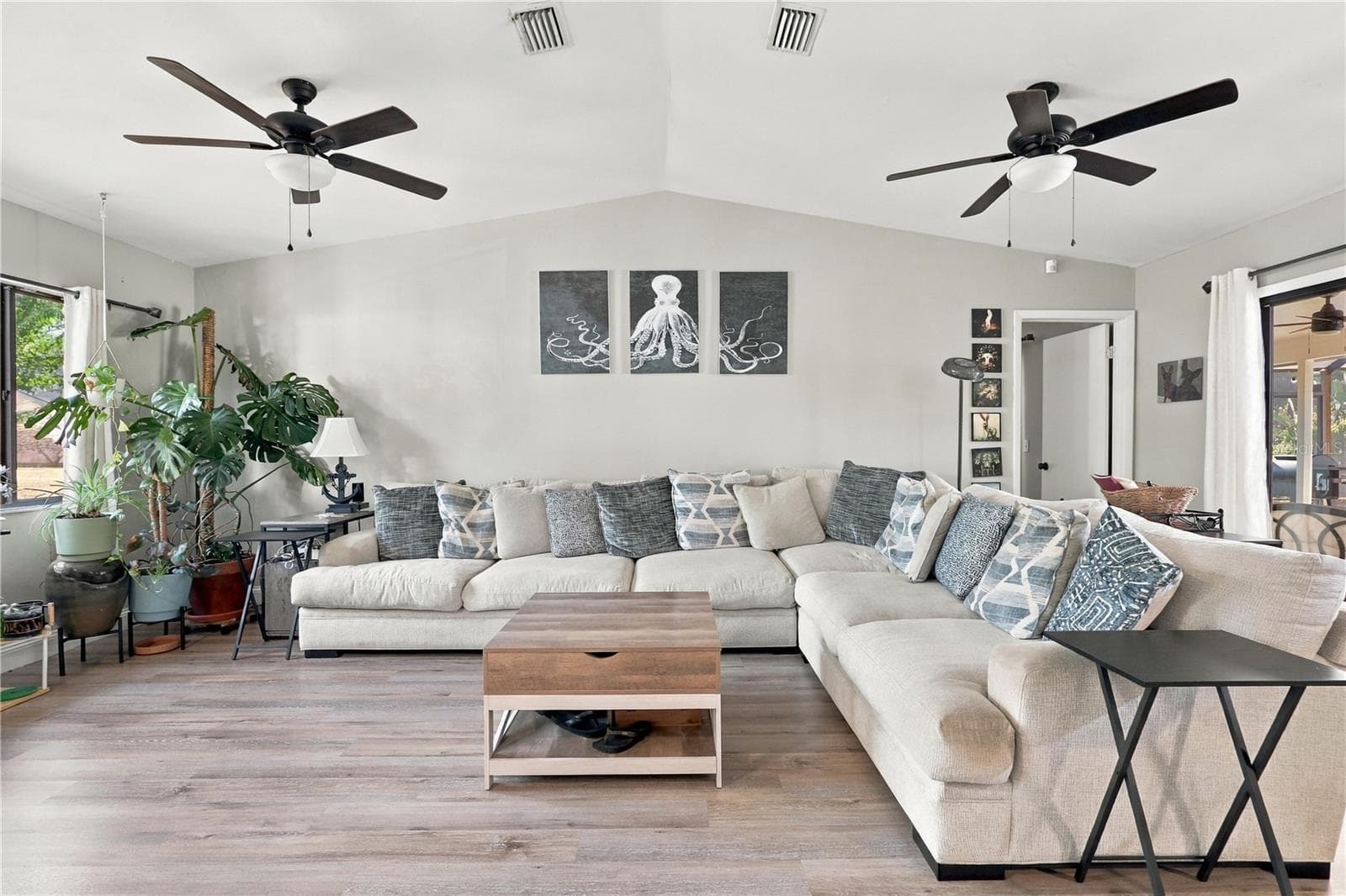 Beautiful, Open Living Room, Vaulted Ceilings, Double Ceiling Fans & Sliding Glass Door to the Pool, Spa & Lanai. - 92 FOSTER LN, PALM COAST