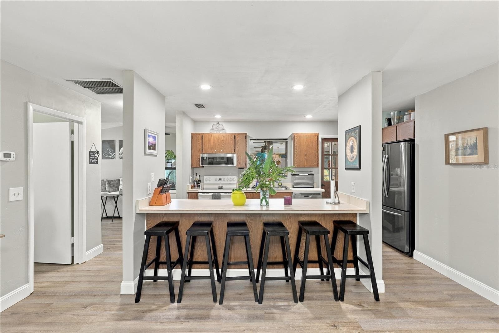 Kitchen, Breakfast Bar, Door to Interior Laundry and Garage on the Left. - 92 FOSTER LN, PALM COAST