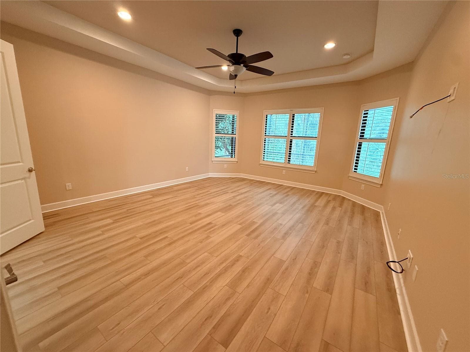 Primary bedroom with new LVP flooring - 10107 WICKER PARK PL, PALMETTO
