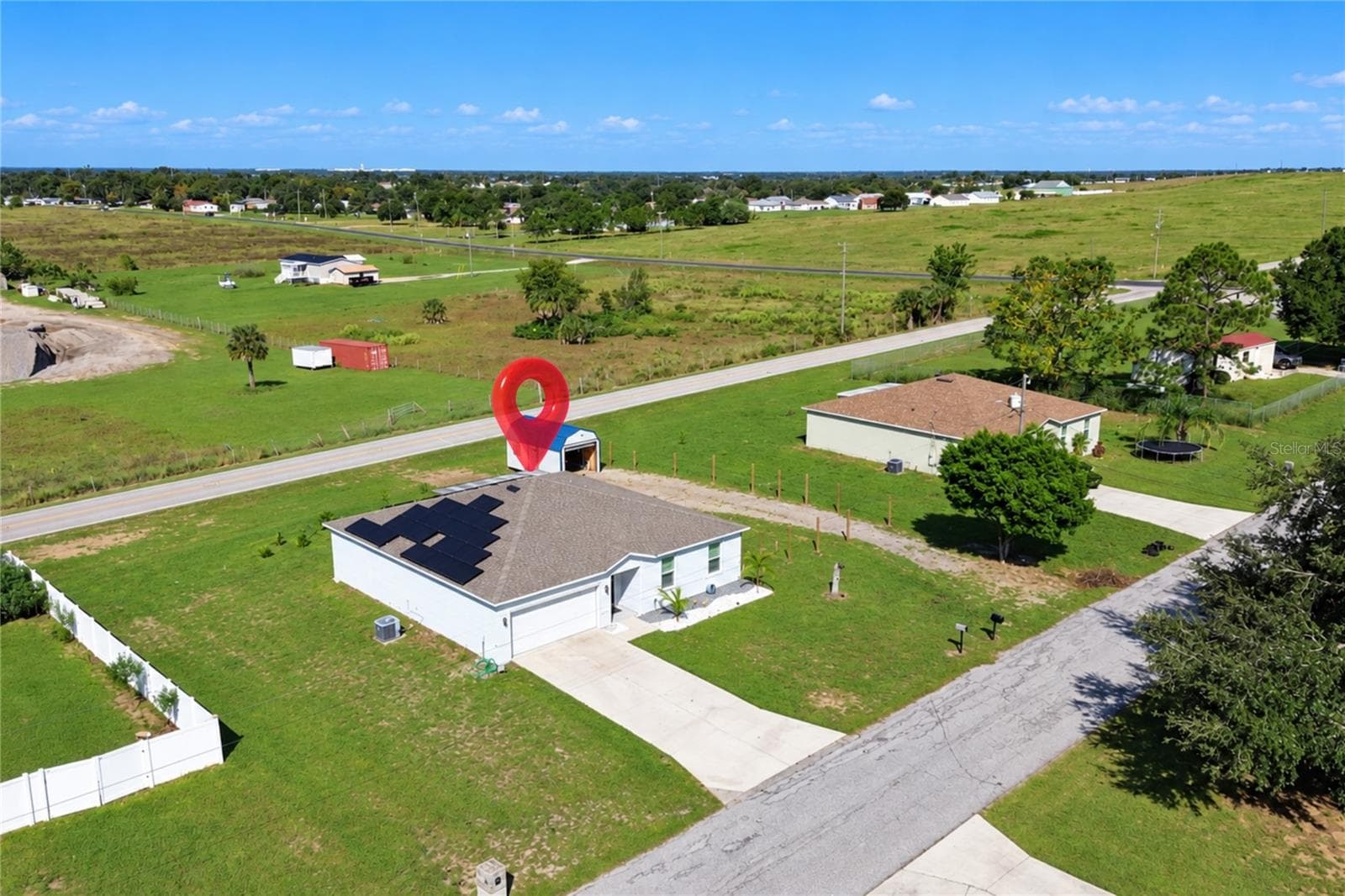 Aerial view showcasing the property and its spacious lot. - 14 ROELS ST, HAINES CITY