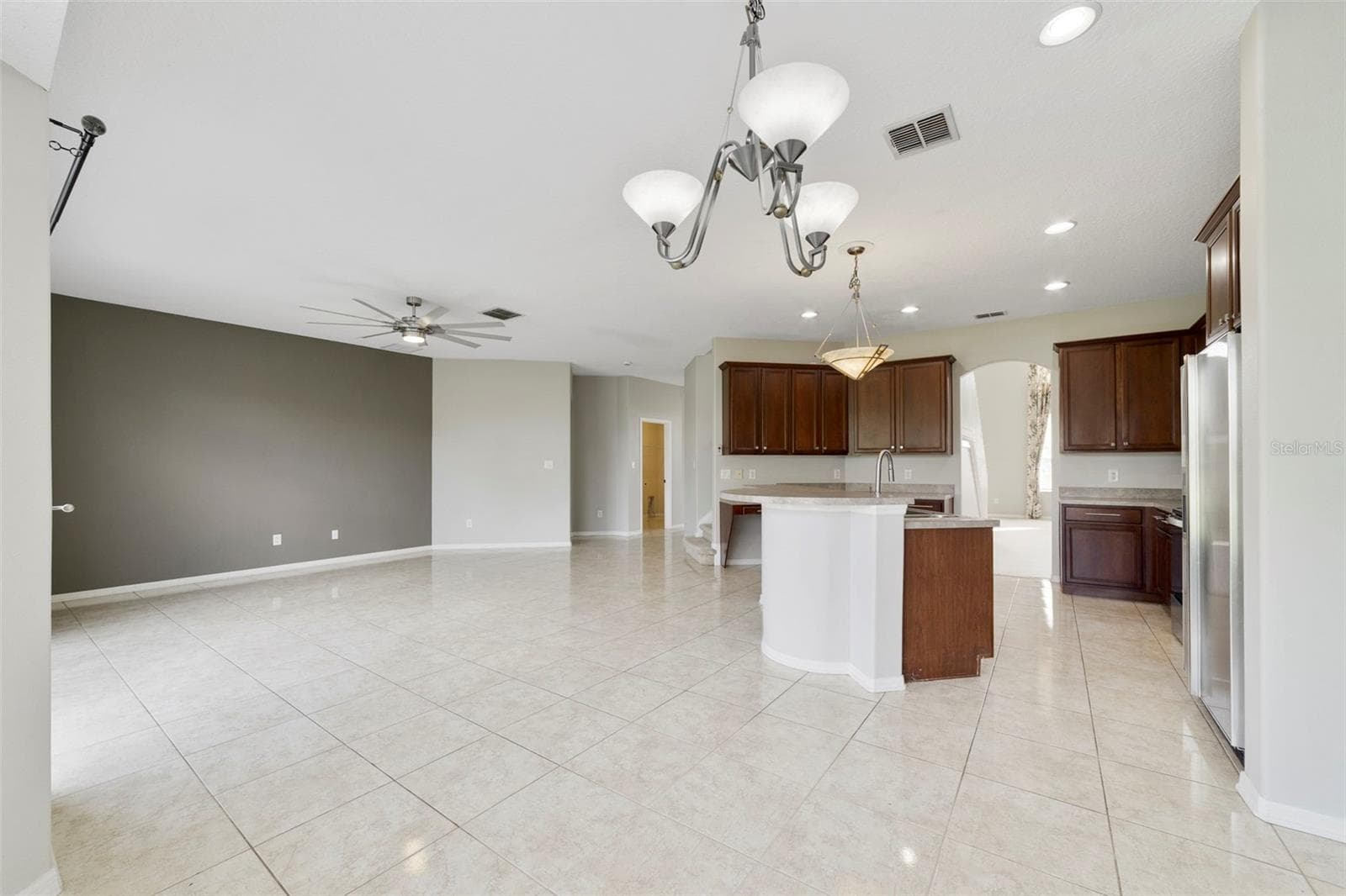 Stainless steel appliances and a SUNNY BREAKFAST NOOK with a bay window overlooking the backyard, complete this inviting space. - 1557 AMARYLLIS CIR, ORLANDO