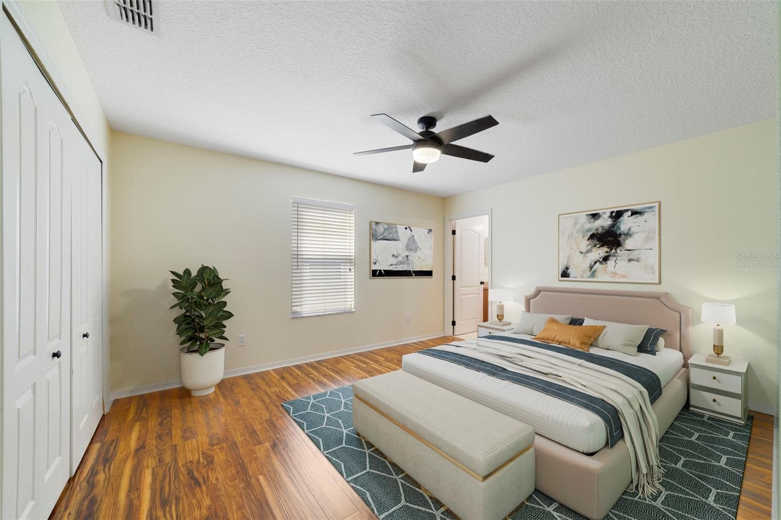 Bedroom 2 provides the ideal space for a guest room, home office or hobby room. Virtually Staged - 1557 AMARYLLIS CIR, ORLANDO