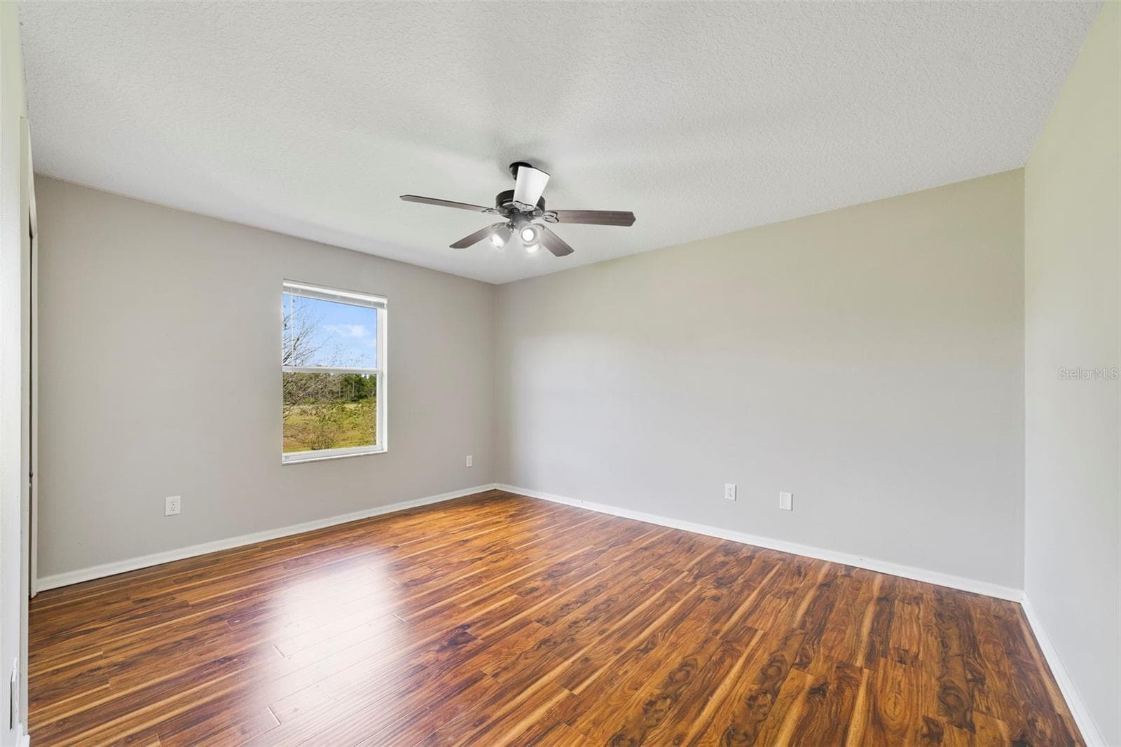 LVP FLOORING throughout the second floor creates a cohesive look. Bedroom 4 - 1557 AMARYLLIS CIR, ORLANDO