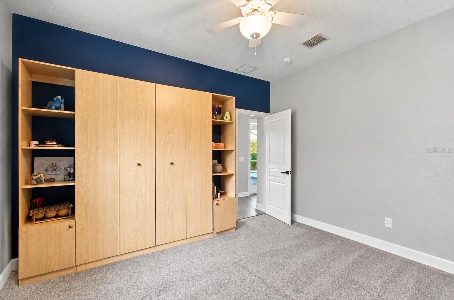 Furniture virtually Bedroom 5 downstairs Murphy bed is built in - 14031 ZEPHERMOOR LN, WINTER GARDEN