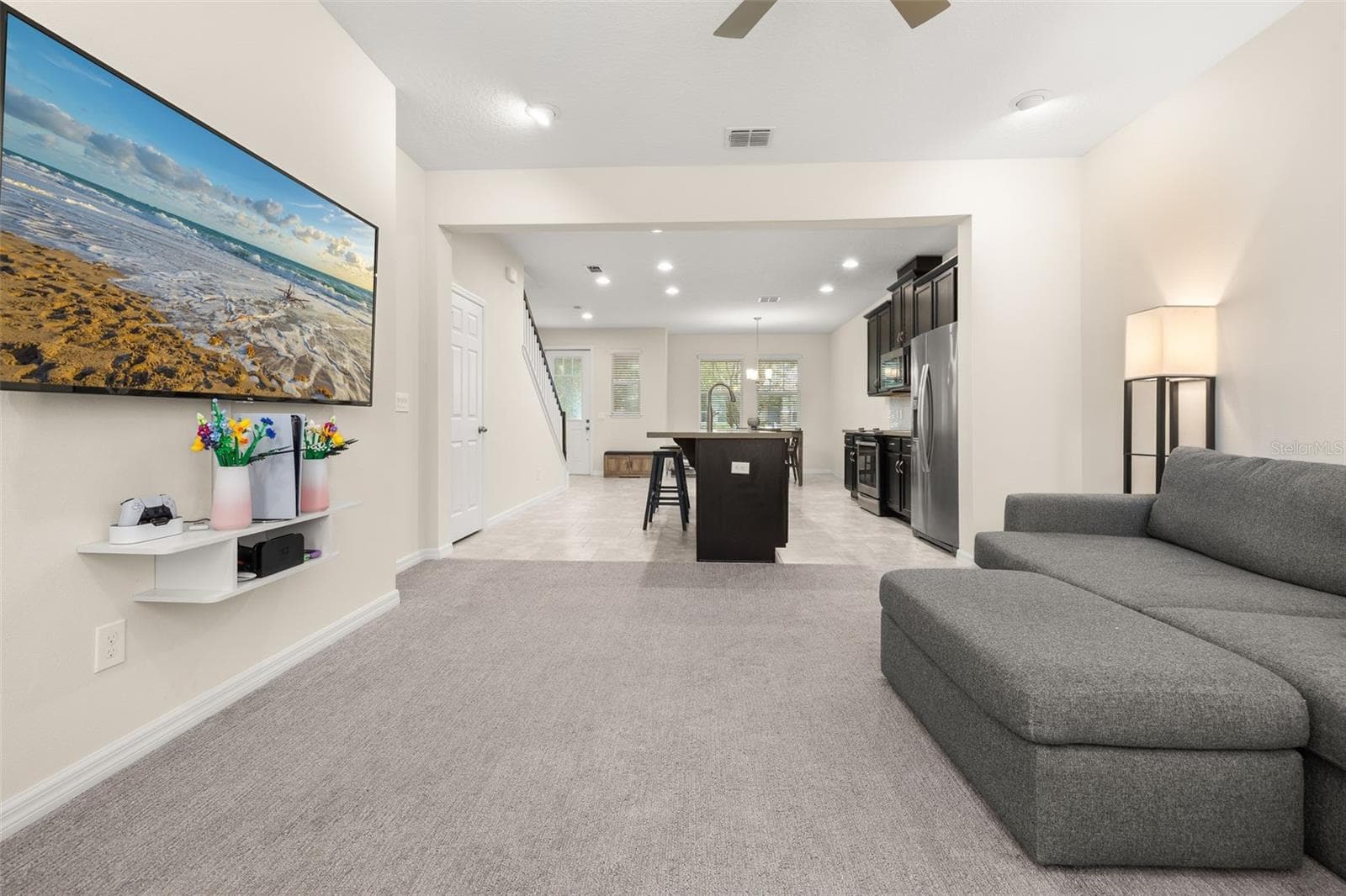 View of the entire downstairs living space from the back of the home - 8067 GLENLLOYD AVE, WINTER GARDEN