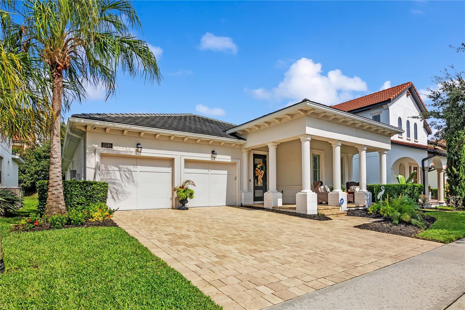 Beautiful curb appeal and timeless architectural details welcome you home. - 15749 CUTTER SAIL PL, WINTER GARDEN