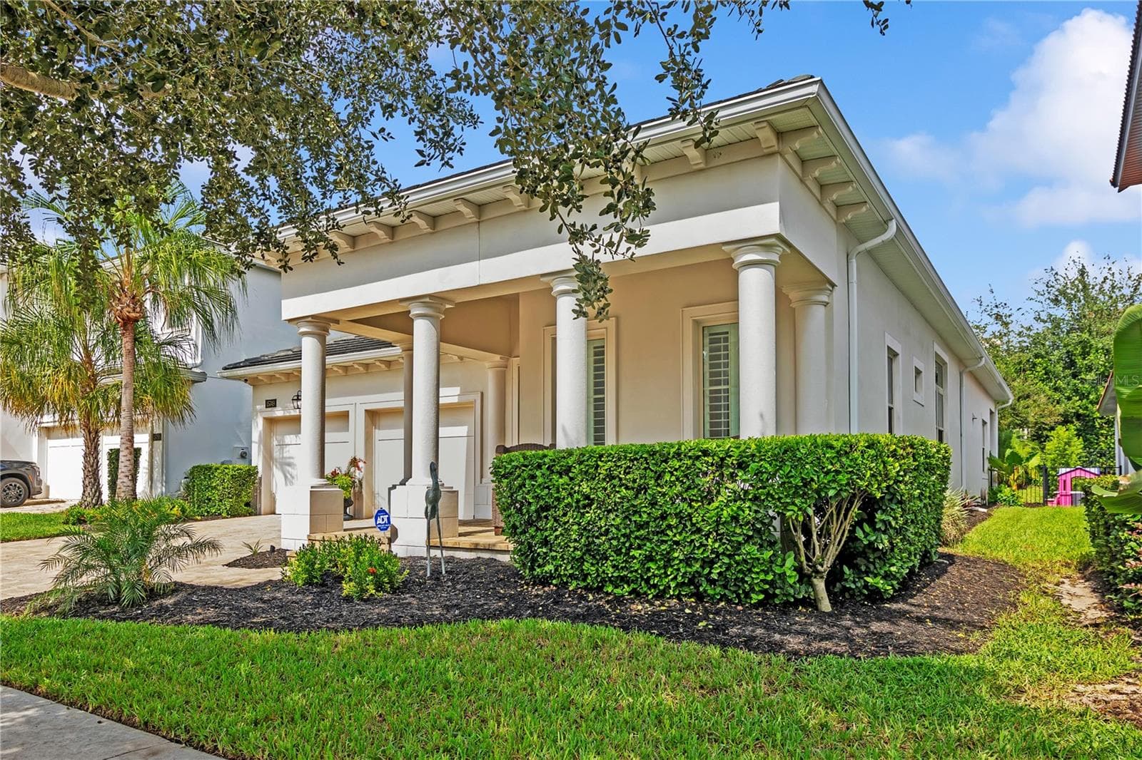 Beautiful curb appeal and timeless architectural details welcome you home. - 15749 CUTTER SAIL PL, WINTER GARDEN