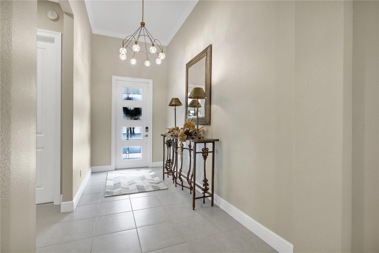 Welcoming entryway with elegant finishes and an inviting atmosphere. - 15749 CUTTER SAIL PL, WINTER GARDEN