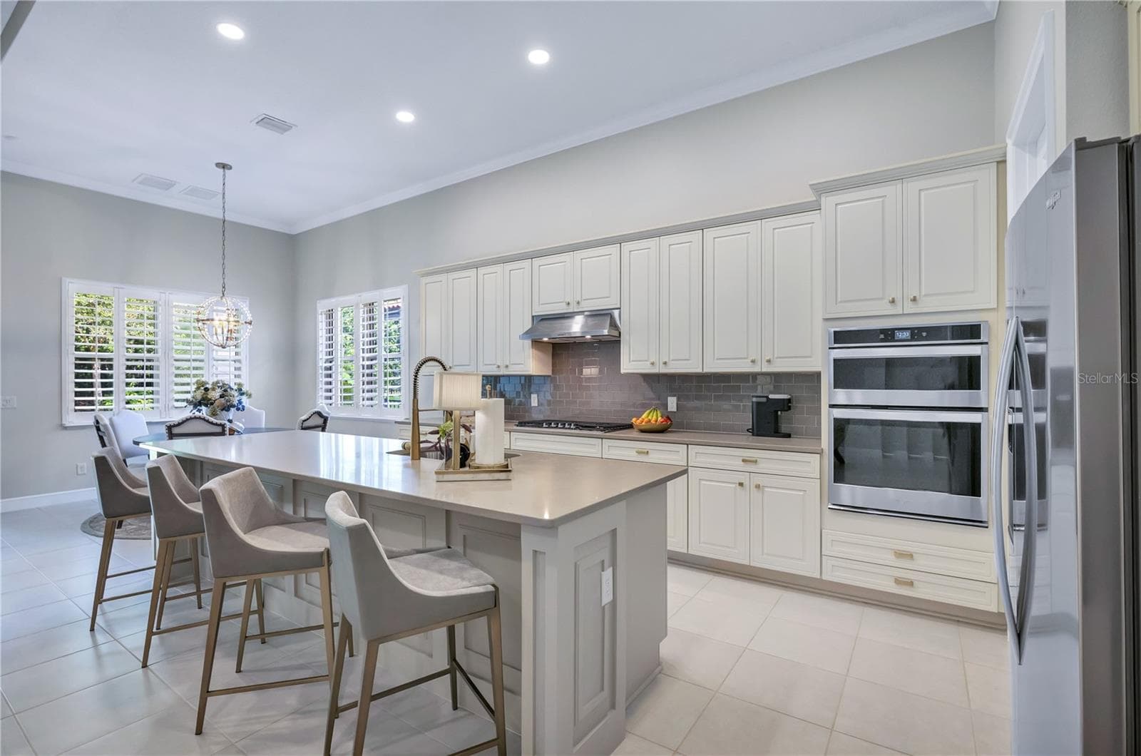 Beautifully appointed kitchen with stylish cabinetry, generous counter space, and an inviting layout. - 15749 CUTTER SAIL PL, WINTER GARDEN