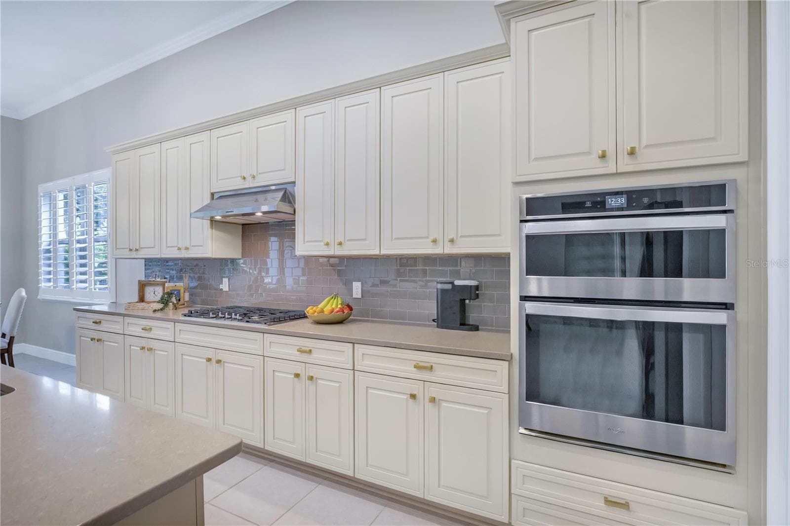Beautifully appointed kitchen featuring generous counter space and stylish finishes. - 15749 CUTTER SAIL PL, WINTER GARDEN