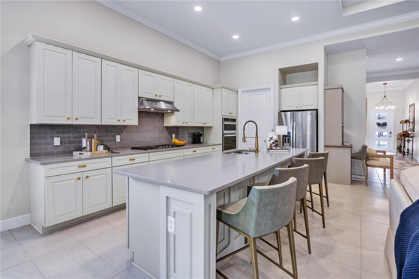 Beautifully appointed kitchen featuring generous counter space and stylish finishes. - 15749 CUTTER SAIL PL, WINTER GARDEN